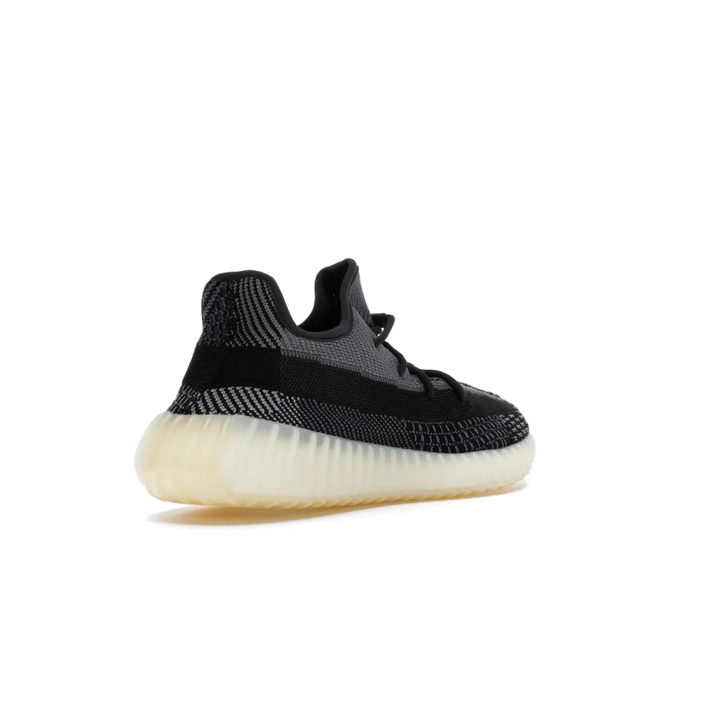 adidas Yeezy Boost 350 V2 Carbon - Image 32 - Only at www.BallersClubKickz.com - Introducing the adidas Yeezy Boost 350 V2 Carbon. Iconic sneaker with a dark-hued upper, breathable Primeknit mesh, signature side stripe, off-white midsole & BOOST cushioning. Perfect for any sneaker lover. Released October 2020.