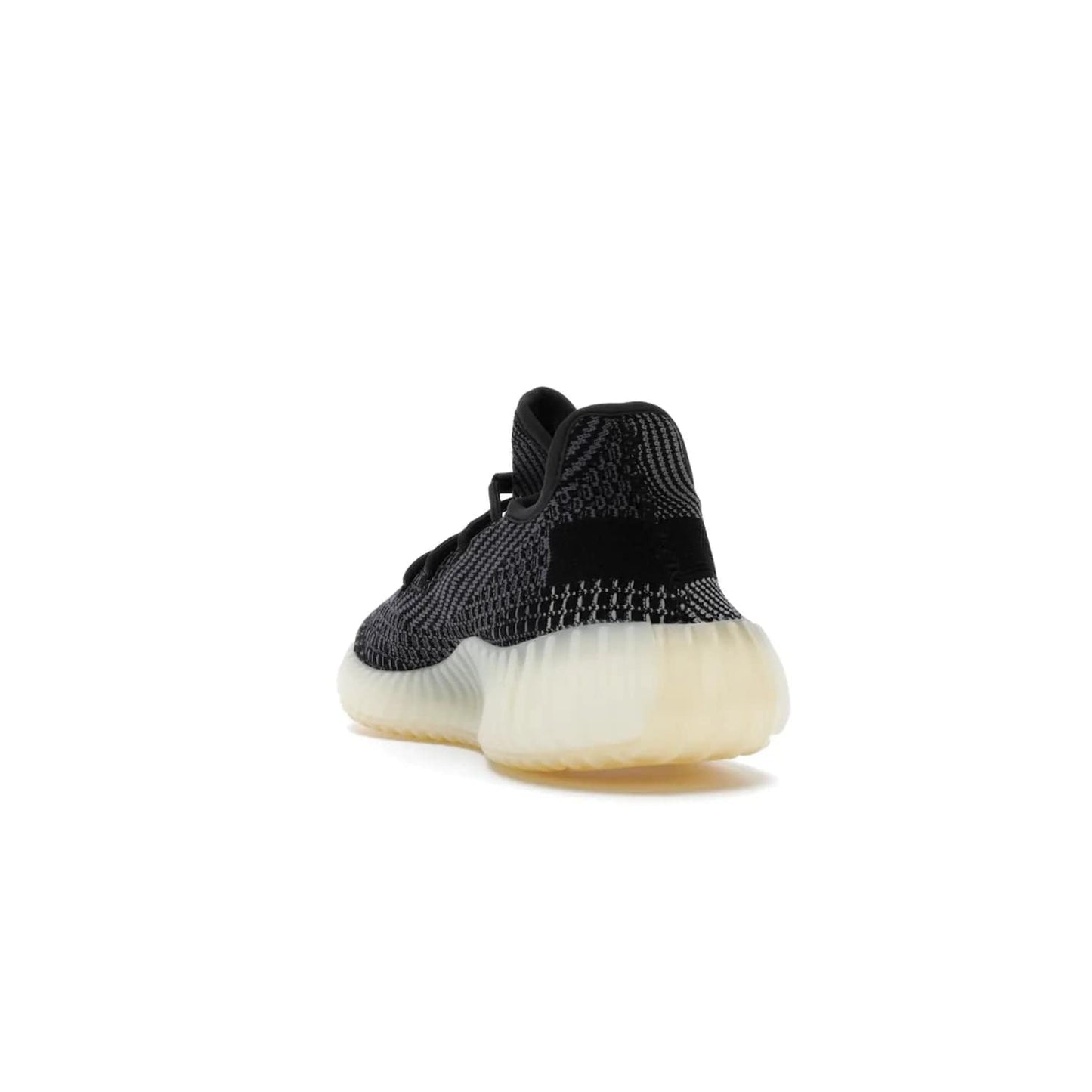 adidas Yeezy Boost 350 V2 Carbon - Image 26 - Only at www.BallersClubKickz.com - Introducing the adidas Yeezy Boost 350 V2 Carbon. Iconic sneaker with a dark-hued upper, breathable Primeknit mesh, signature side stripe, off-white midsole & BOOST cushioning. Perfect for any sneaker lover. Released October 2020.