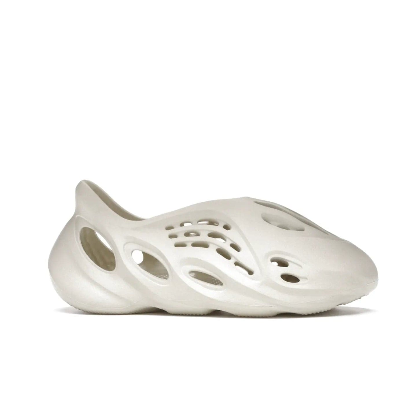 adidas Yeezy Foam RNNR Sand - Image 2 - Only at www.BallersClubKickz.com - Adidas Yeezy Foam RNNR Sand combines style and comfort for the perfect everyday sneaker. Monochromatic Sand upper, foam midsole, rubber outsole, and oval cut-outs for a modern look. Lacing system ensures foot stays secure. Elevate any outfit with style.