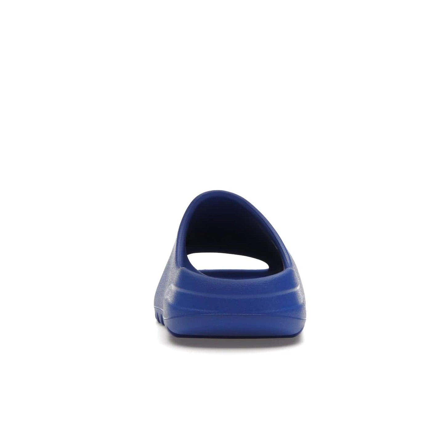 adidas Yeezy Slide Azure - Image 28 - Only at www.BallersClubKickz.com - Elevate your look with the adidas Yeezy Slide Azure. Boasting a vibrant hue for a unique style, this EVA foam slide is a statement of fearlessness and stylish expression. Step out with confidence knowing you're wearing more than a slide.