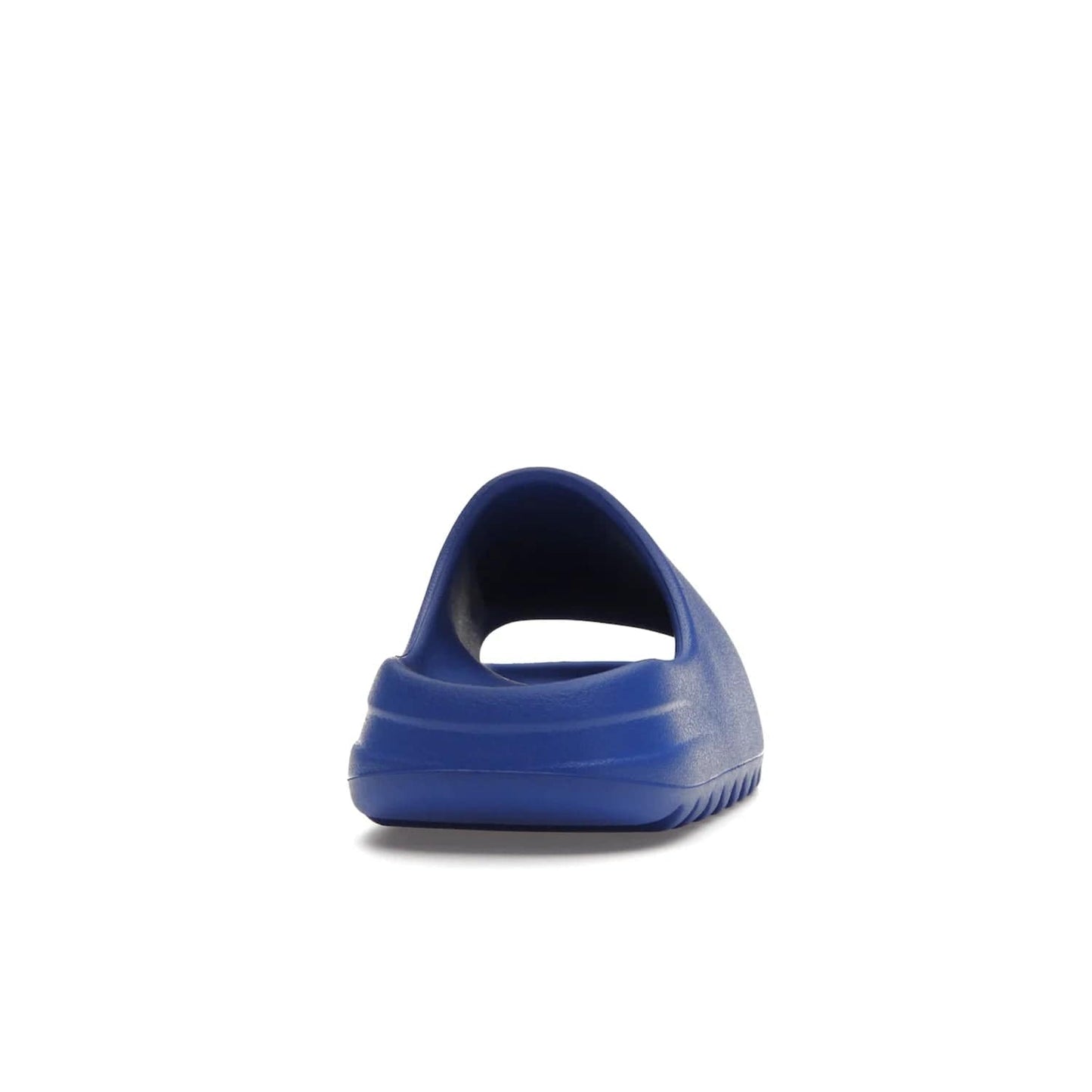 adidas Yeezy Slide Azure - Image 29 - Only at www.BallersClubKickz.com - Elevate your look with the adidas Yeezy Slide Azure. Boasting a vibrant hue for a unique style, this EVA foam slide is a statement of fearlessness and stylish expression. Step out with confidence knowing you're wearing more than a slide.