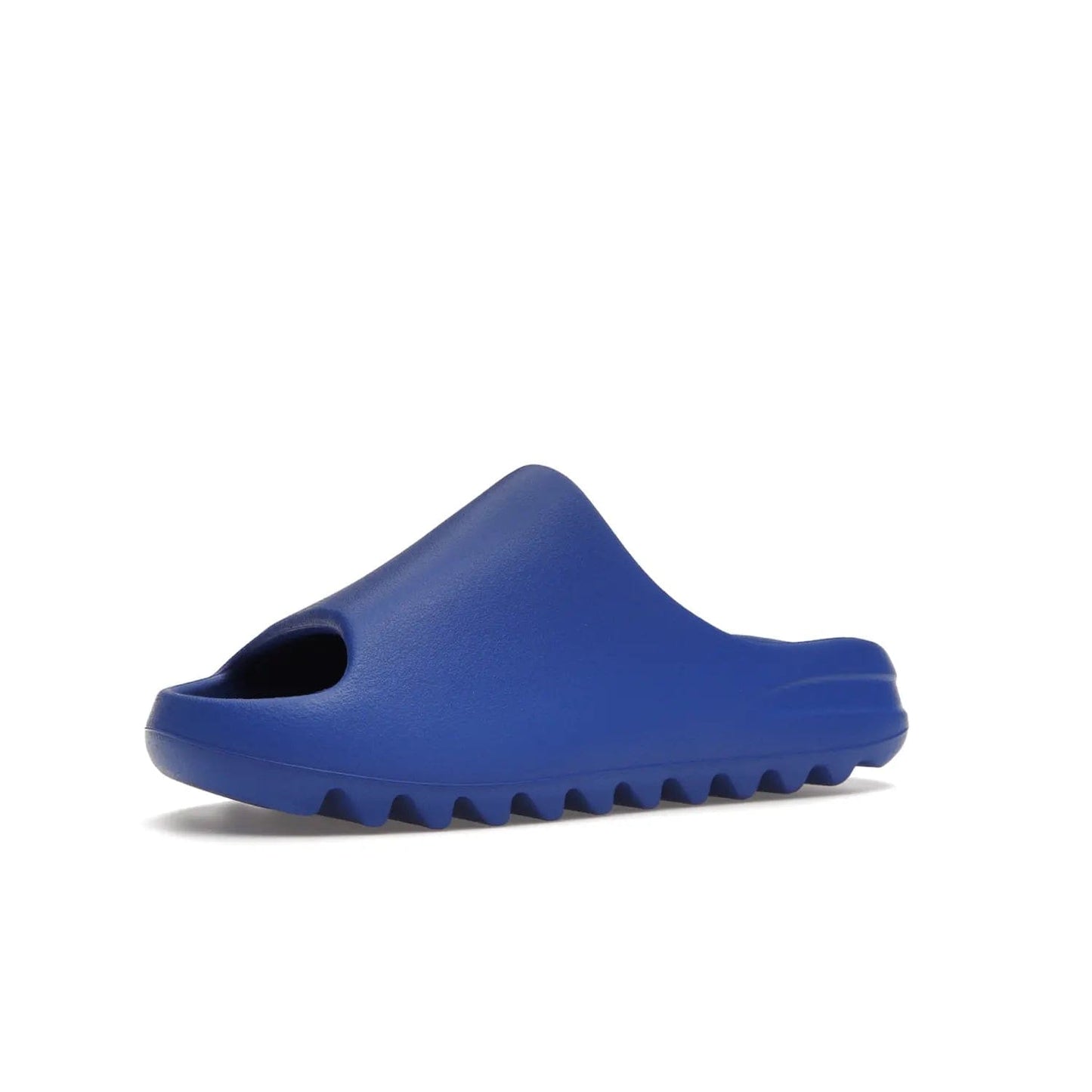 adidas Yeezy Slide Azure - Image 16 - Only at www.BallersClubKickz.com - Elevate your look with the adidas Yeezy Slide Azure. Boasting a vibrant hue for a unique style, this EVA foam slide is a statement of fearlessness and stylish expression. Step out with confidence knowing you're wearing more than a slide.