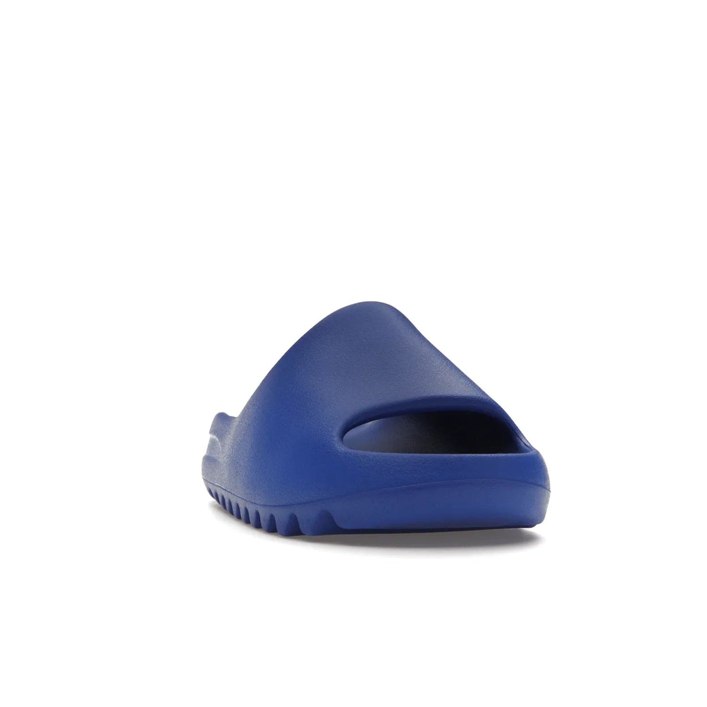 adidas Yeezy Slide Azure - Image 8 - Only at www.BallersClubKickz.com - Elevate your look with the adidas Yeezy Slide Azure. Boasting a vibrant hue for a unique style, this EVA foam slide is a statement of fearlessness and stylish expression. Step out with confidence knowing you're wearing more than a slide.