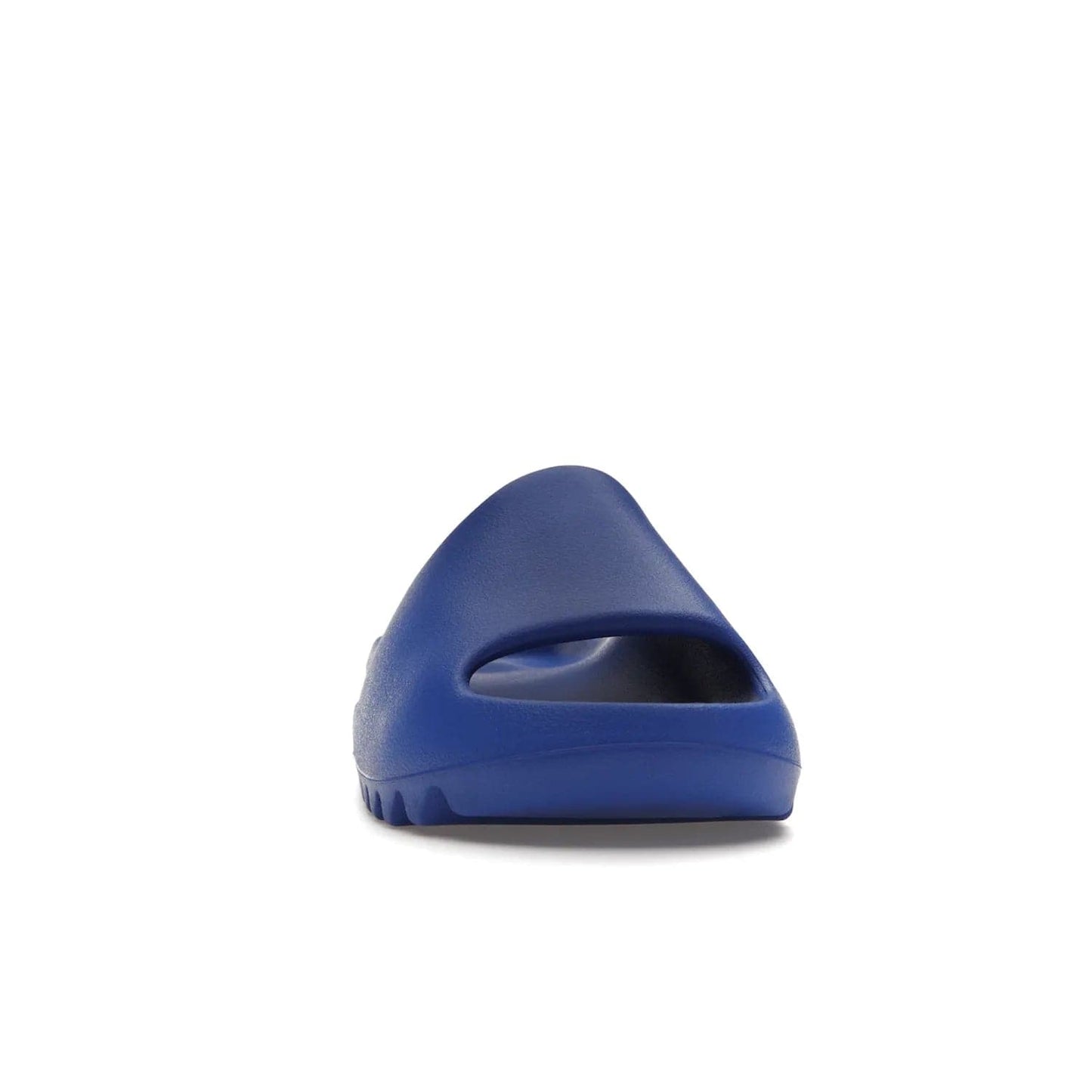 adidas Yeezy Slide Azure - Image 9 - Only at www.BallersClubKickz.com - Elevate your look with the adidas Yeezy Slide Azure. Boasting a vibrant hue for a unique style, this EVA foam slide is a statement of fearlessness and stylish expression. Step out with confidence knowing you're wearing more than a slide.
