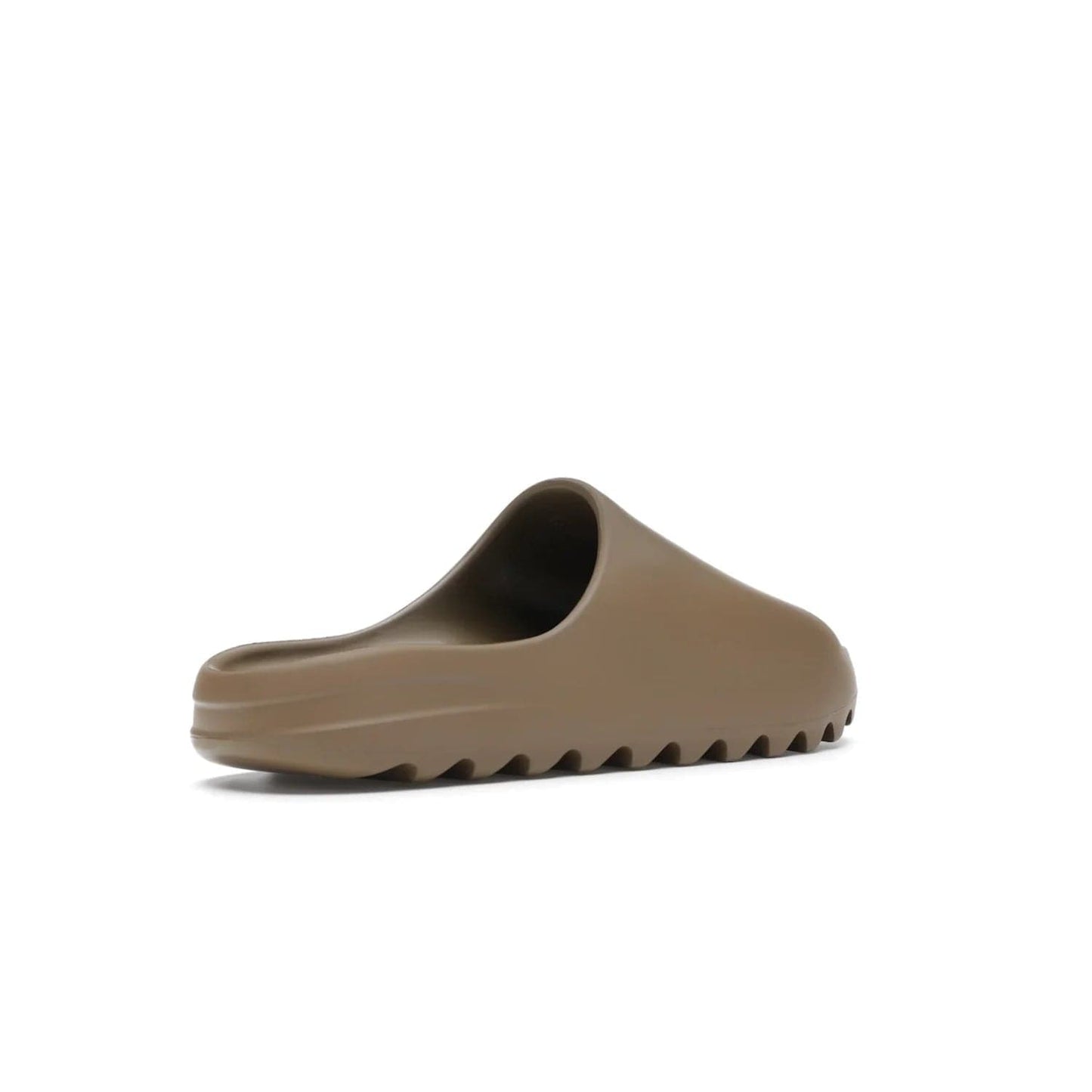 adidas Yeezy Slide Core - Image 33 - Only at www.BallersClubKickz.com - Experience lightweight comfort and cushioning with the adidas Yeezy Slide Core. Features EVA foam upper, soft footbed & grooved outsole for optimal traction & support. The Core/Core/Core colorway released April 2021.