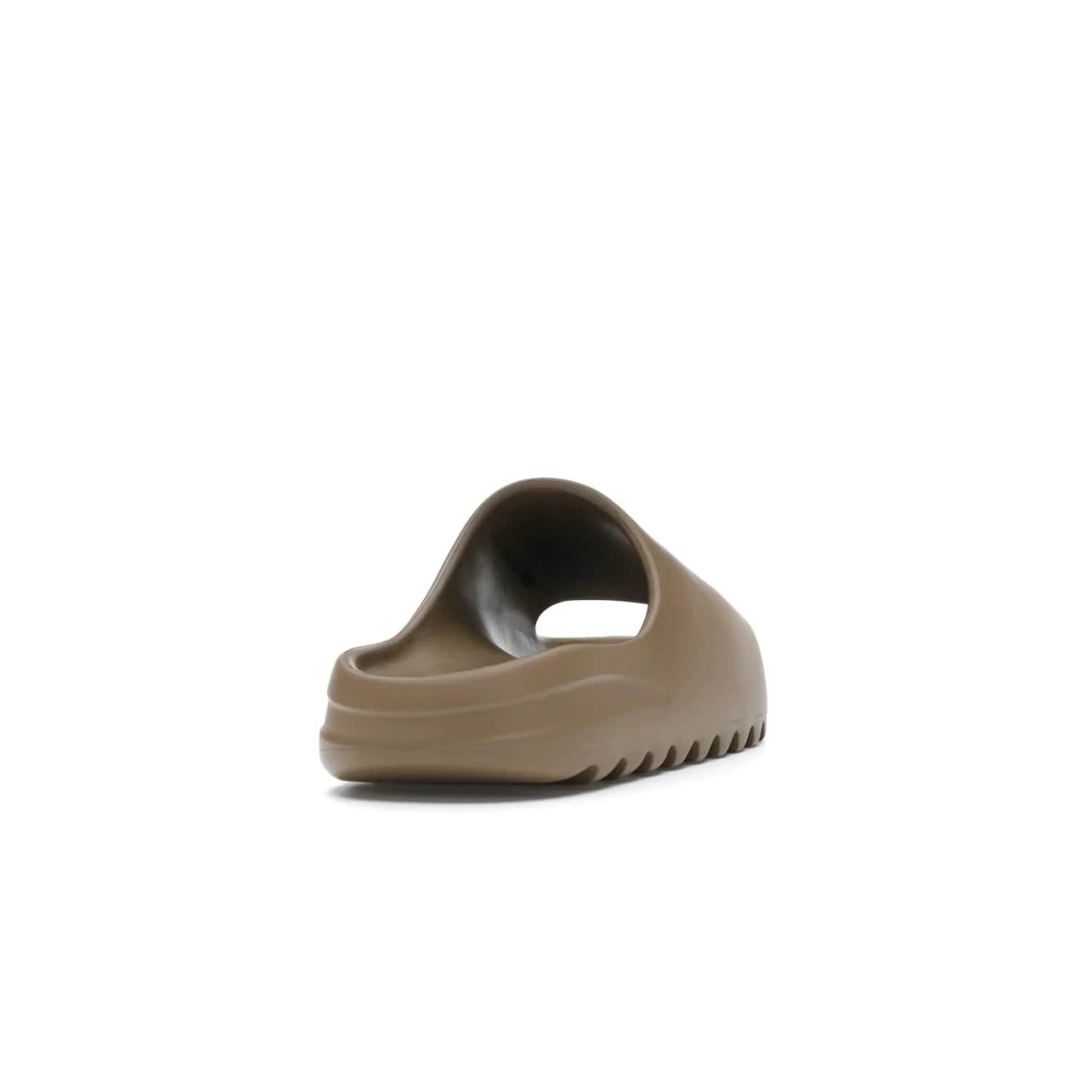 adidas Yeezy Slide Core - Image 30 - Only at www.BallersClubKickz.com - Experience lightweight comfort and cushioning with the adidas Yeezy Slide Core. Features EVA foam upper, soft footbed & grooved outsole for optimal traction & support. The Core/Core/Core colorway released April 2021.