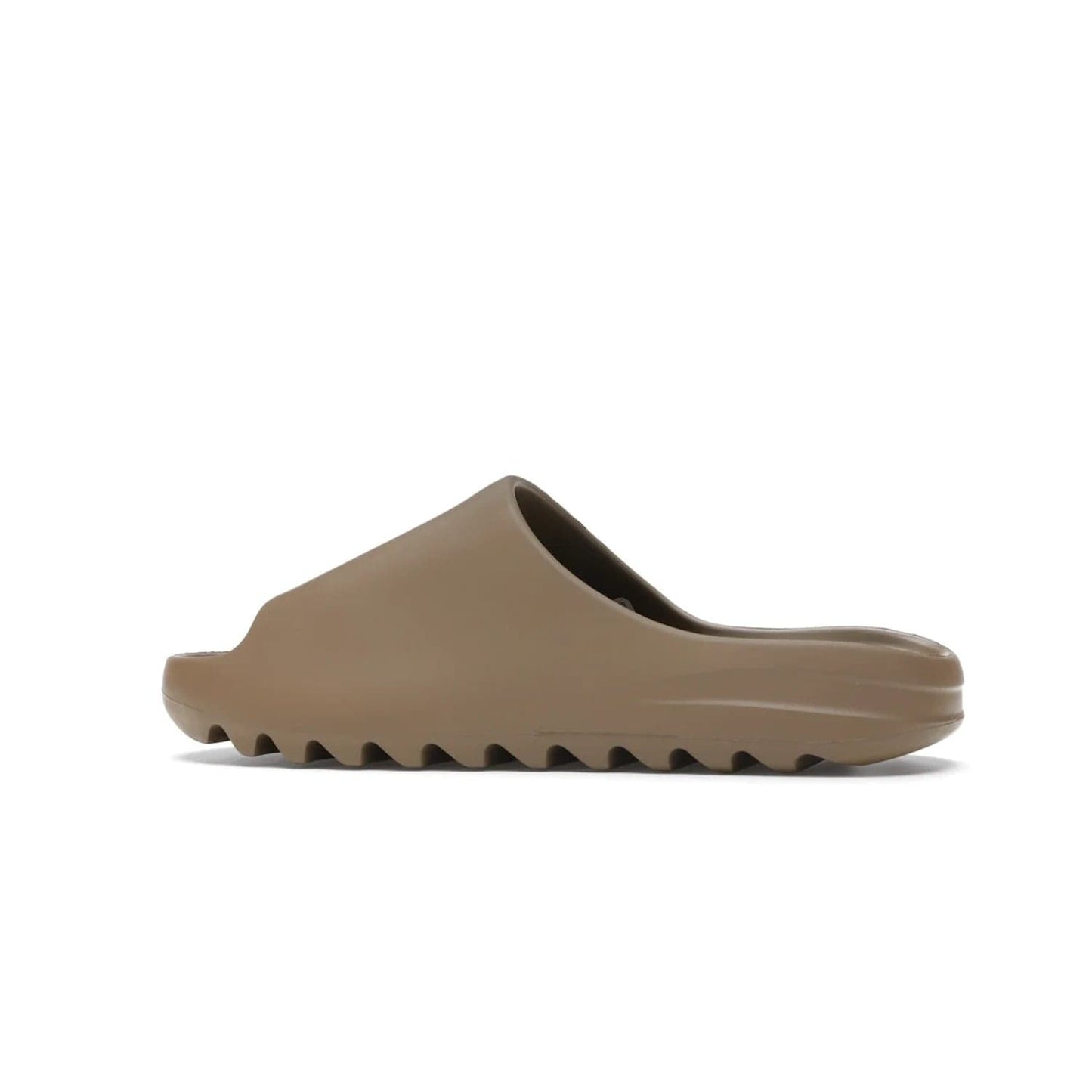 adidas Yeezy Slide Core - Image 21 - Only at www.BallersClubKickz.com - Experience lightweight comfort and cushioning with the adidas Yeezy Slide Core. Features EVA foam upper, soft footbed & grooved outsole for optimal traction & support. The Core/Core/Core colorway released April 2021.