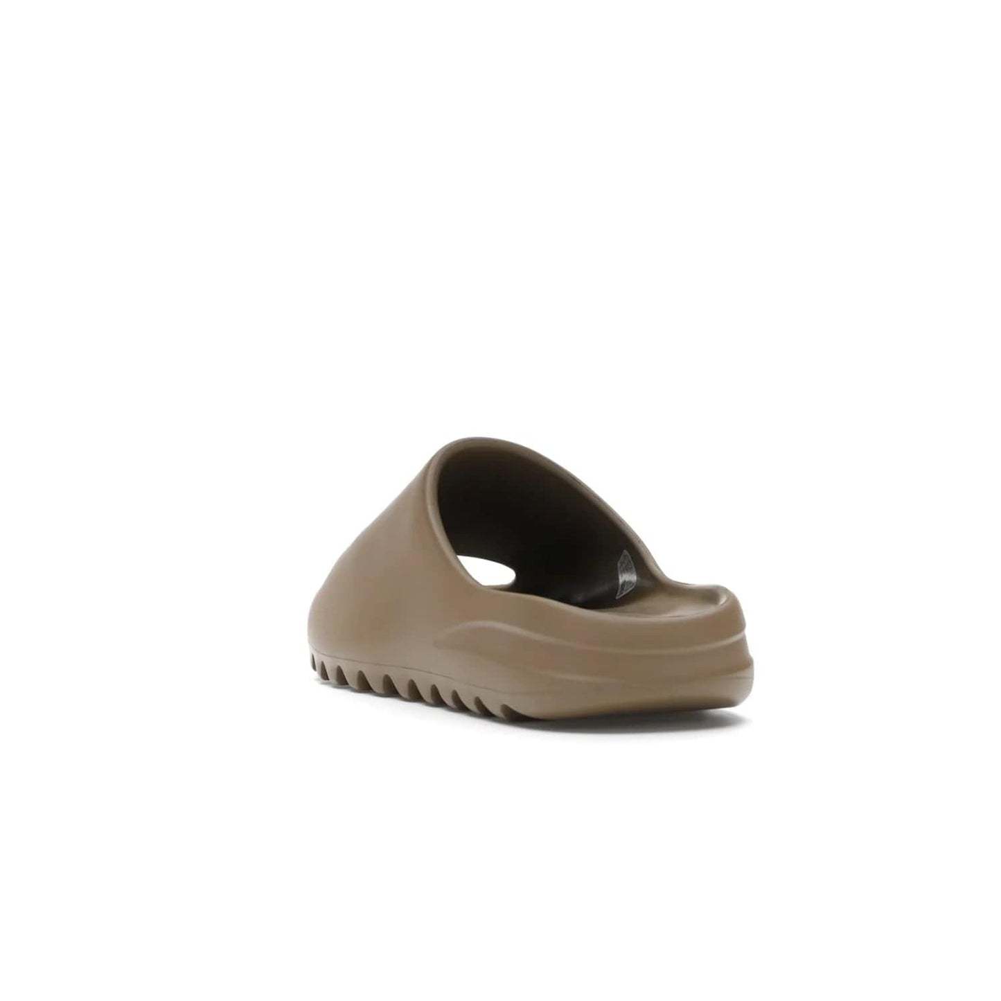 adidas Yeezy Slide Core - Image 26 - Only at www.BallersClubKickz.com - Experience lightweight comfort and cushioning with the adidas Yeezy Slide Core. Features EVA foam upper, soft footbed & grooved outsole for optimal traction & support. The Core/Core/Core colorway released April 2021.