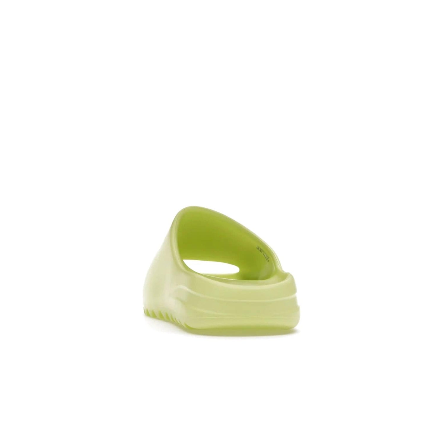 adidas Yeezy Slide Glow Green - Image 27 - Only at www.BallersClubKickz.com - Experience an unexpected summer style with the adidas Yeezy Slide Glow Green. This limited edition slide sandal provides a lightweight and durable construction and a bold Glow Green hue. Strategic grooves enhance traction and provide all-day comfort. Make a statement with the adidas Yeezy Slide Glow Green.