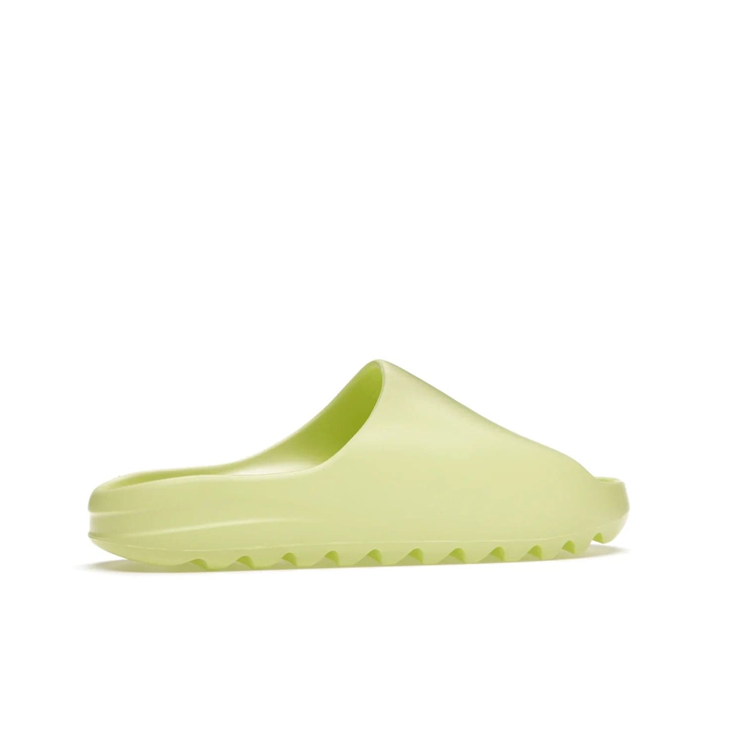 adidas Yeezy Slide Glow Green - Image 35 - Only at www.BallersClubKickz.com - Experience an unexpected summer style with the adidas Yeezy Slide Glow Green. This limited edition slide sandal provides a lightweight and durable construction and a bold Glow Green hue. Strategic grooves enhance traction and provide all-day comfort. Make a statement with the adidas Yeezy Slide Glow Green.