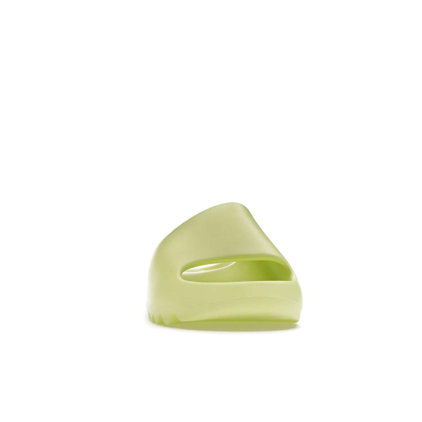 adidas Yeezy Slide Glow Green - Image 9 - Only at www.BallersClubKickz.com - Experience an unexpected summer style with the adidas Yeezy Slide Glow Green. This limited edition slide sandal provides a lightweight and durable construction and a bold Glow Green hue. Strategic grooves enhance traction and provide all-day comfort. Make a statement with the adidas Yeezy Slide Glow Green.