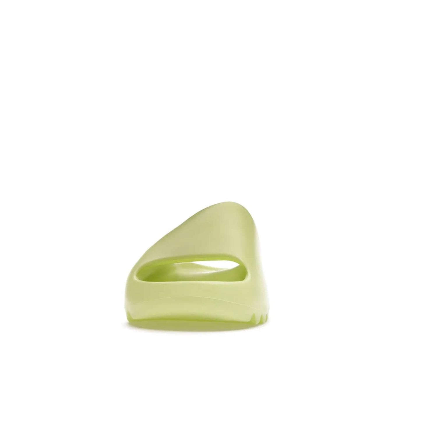 adidas Yeezy Slide Glow Green - Image 11 - Only at www.BallersClubKickz.com - Experience an unexpected summer style with the adidas Yeezy Slide Glow Green. This limited edition slide sandal provides a lightweight and durable construction and a bold Glow Green hue. Strategic grooves enhance traction and provide all-day comfort. Make a statement with the adidas Yeezy Slide Glow Green.