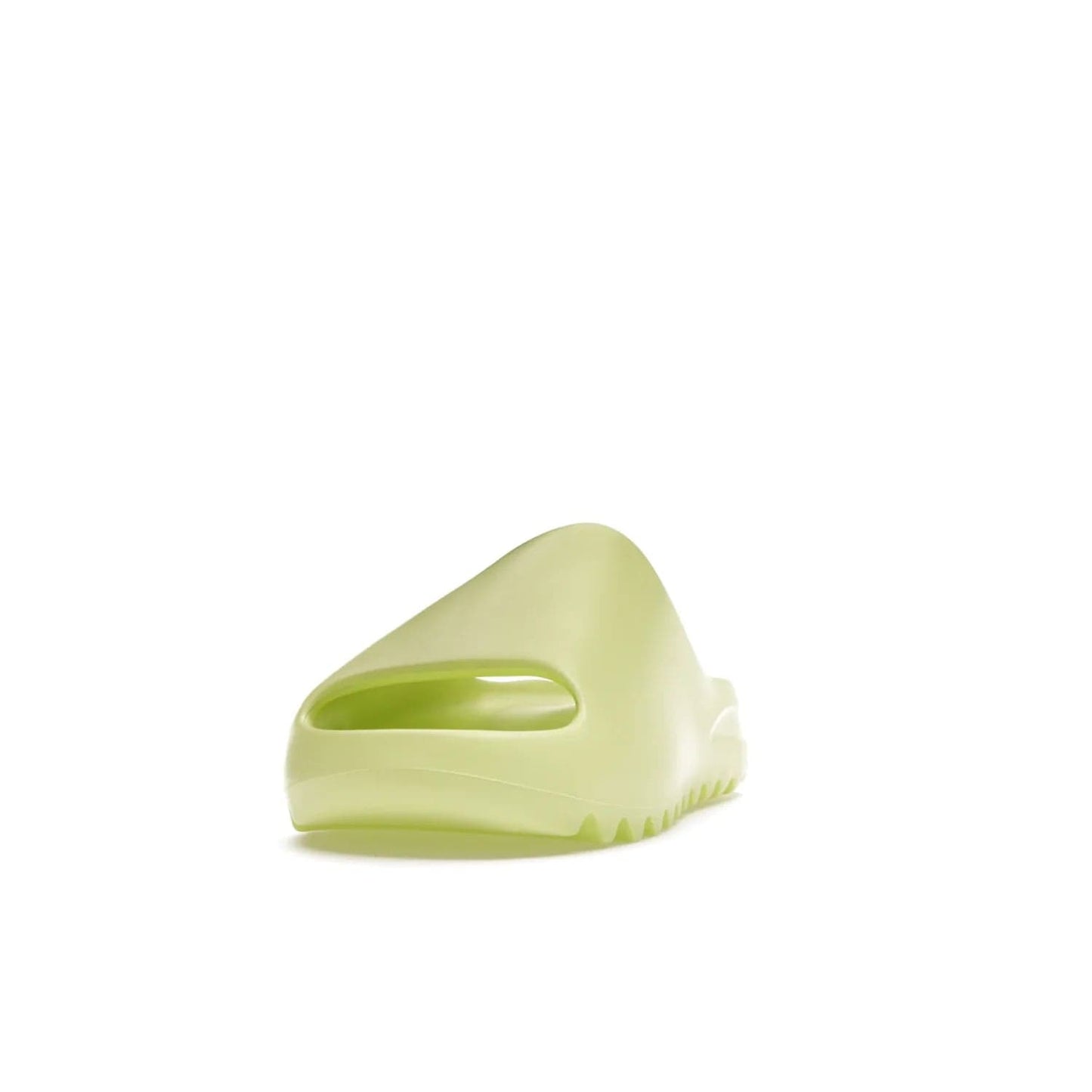 adidas Yeezy Slide Glow Green - Image 12 - Only at www.BallersClubKickz.com - Experience an unexpected summer style with the adidas Yeezy Slide Glow Green. This limited edition slide sandal provides a lightweight and durable construction and a bold Glow Green hue. Strategic grooves enhance traction and provide all-day comfort. Make a statement with the adidas Yeezy Slide Glow Green.