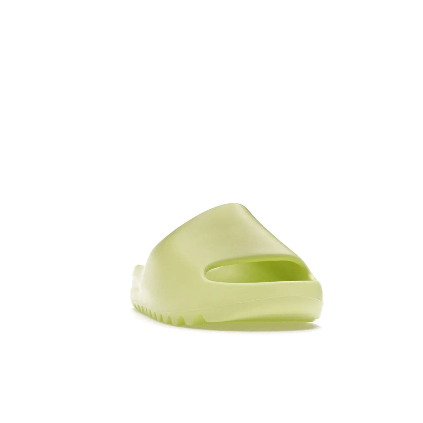 adidas Yeezy Slide Glow Green - Image 8 - Only at www.BallersClubKickz.com - Experience an unexpected summer style with the adidas Yeezy Slide Glow Green. This limited edition slide sandal provides a lightweight and durable construction and a bold Glow Green hue. Strategic grooves enhance traction and provide all-day comfort. Make a statement with the adidas Yeezy Slide Glow Green.