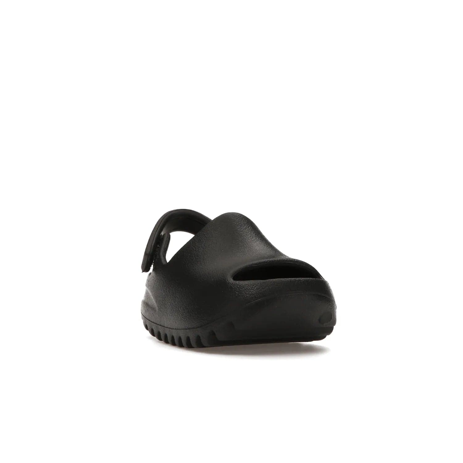 adidas Yeezy Slide Onyx (Infants) - Image 7 - Only at www.BallersClubKickz.com - The Adidas Yeezy Slide Onyx (Infant) is a classic silhouette with unique features and durable EVA foam. Released in May 2021 with a starting price of $70, it's no wonder it quickly gained popularity with its cool, minimalist look.