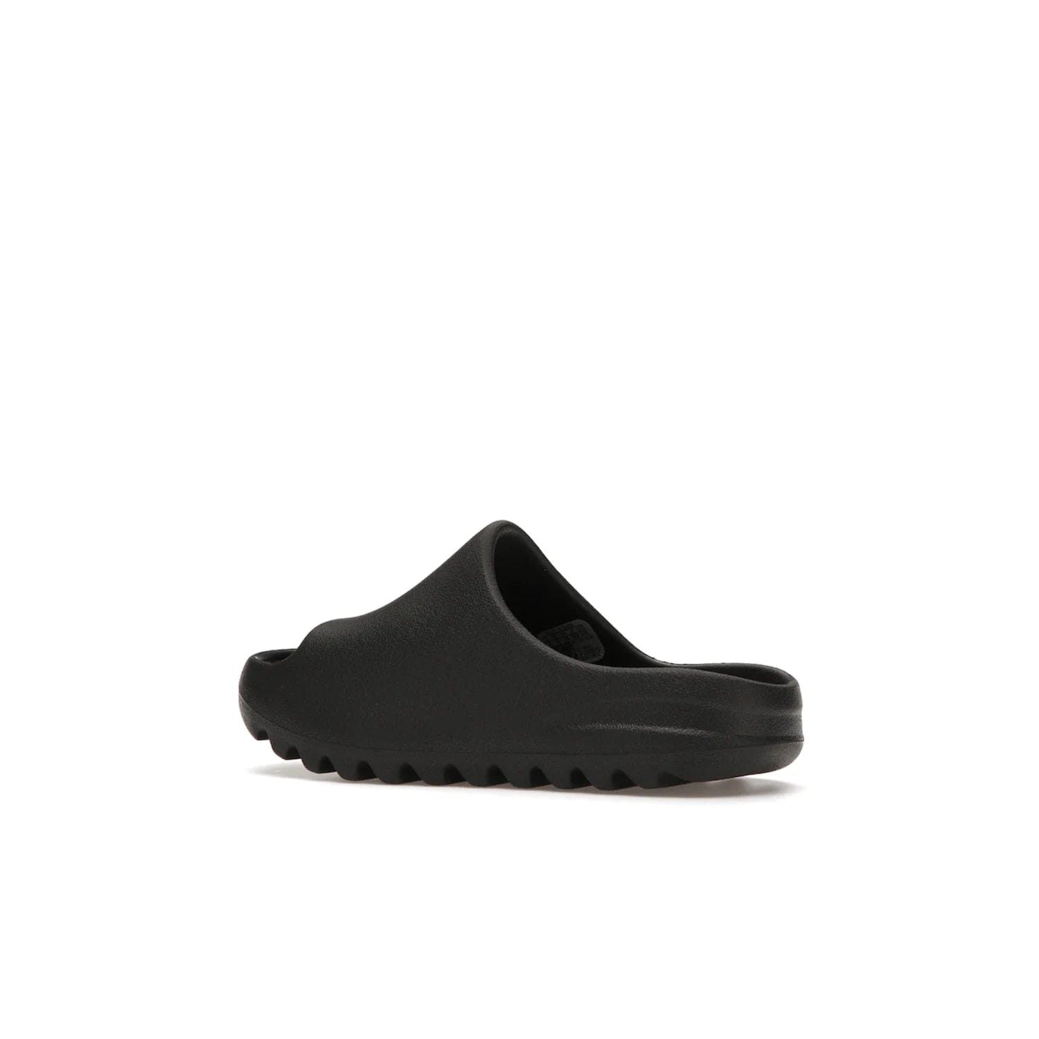 adidas Yeezy Slide Onyx (Kids) - Image 22 - Only at www.BallersClubKickz.com - adidas Yeezy Slide Onyx (Kids): Comfortable foam construction with textured surface and iconic three-stripe logo. Breathable, open-toe design and deep grooves for traction. Released in March 2021 at $50.