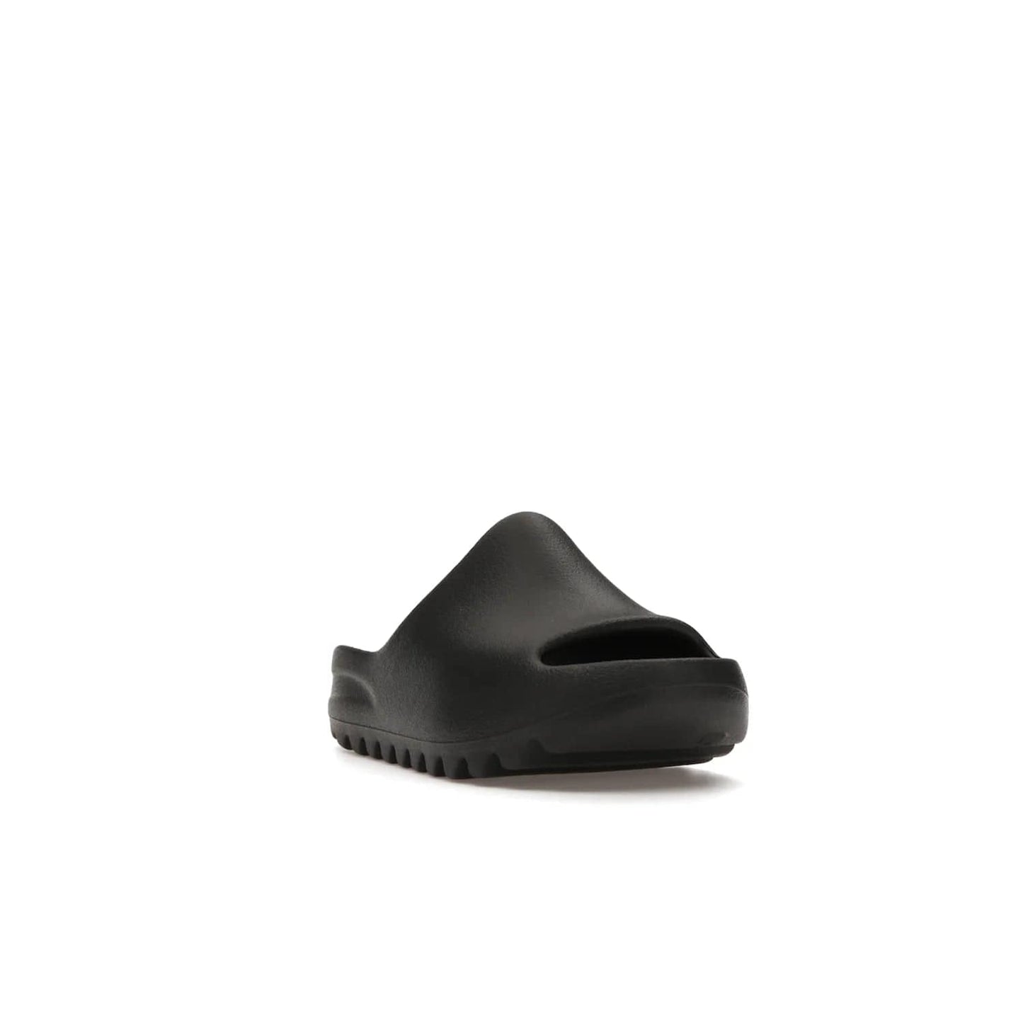 adidas Yeezy Slide Onyx (Kids) - Image 7 - Only at www.BallersClubKickz.com - adidas Yeezy Slide Onyx (Kids): Comfortable foam construction with textured surface and iconic three-stripe logo. Breathable, open-toe design and deep grooves for traction. Released in March 2021 at $50.
