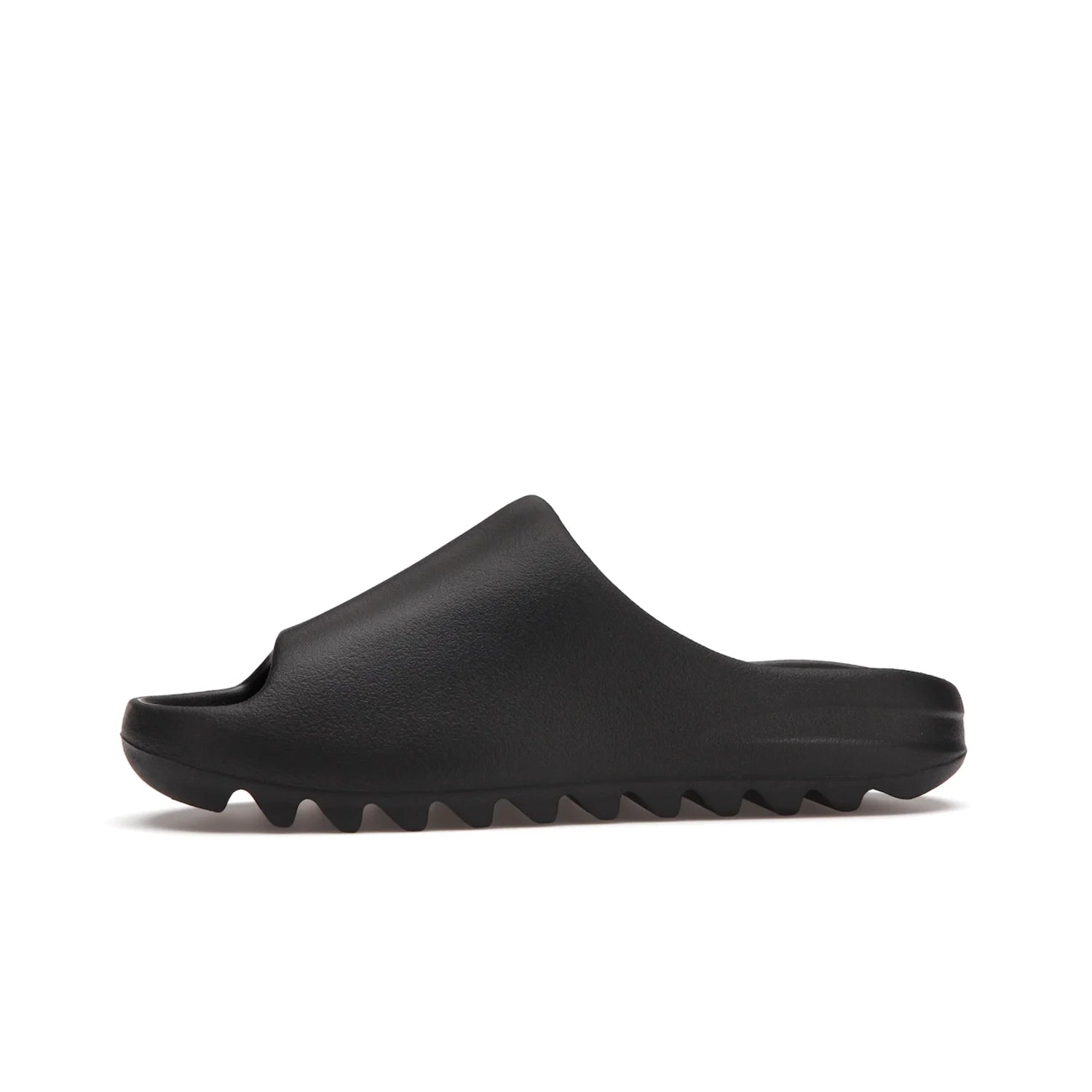 adidas Yeezy Slide Onyx - Image 18 - Only at www.BallersClubKickz.com - Step into comfort and style with the adidas Yeezy Slide Onyx. Featuring foam construction, an all-black colorway and a grooved outsole for stability and responsiveness, this versatile slide is a must-have for your collection.