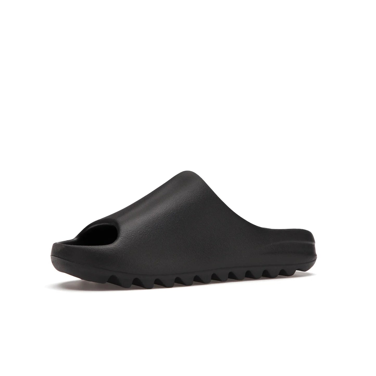 adidas Yeezy Slide Onyx - Image 16 - Only at www.BallersClubKickz.com - Step into comfort and style with the adidas Yeezy Slide Onyx. Featuring foam construction, an all-black colorway and a grooved outsole for stability and responsiveness, this versatile slide is a must-have for your collection.