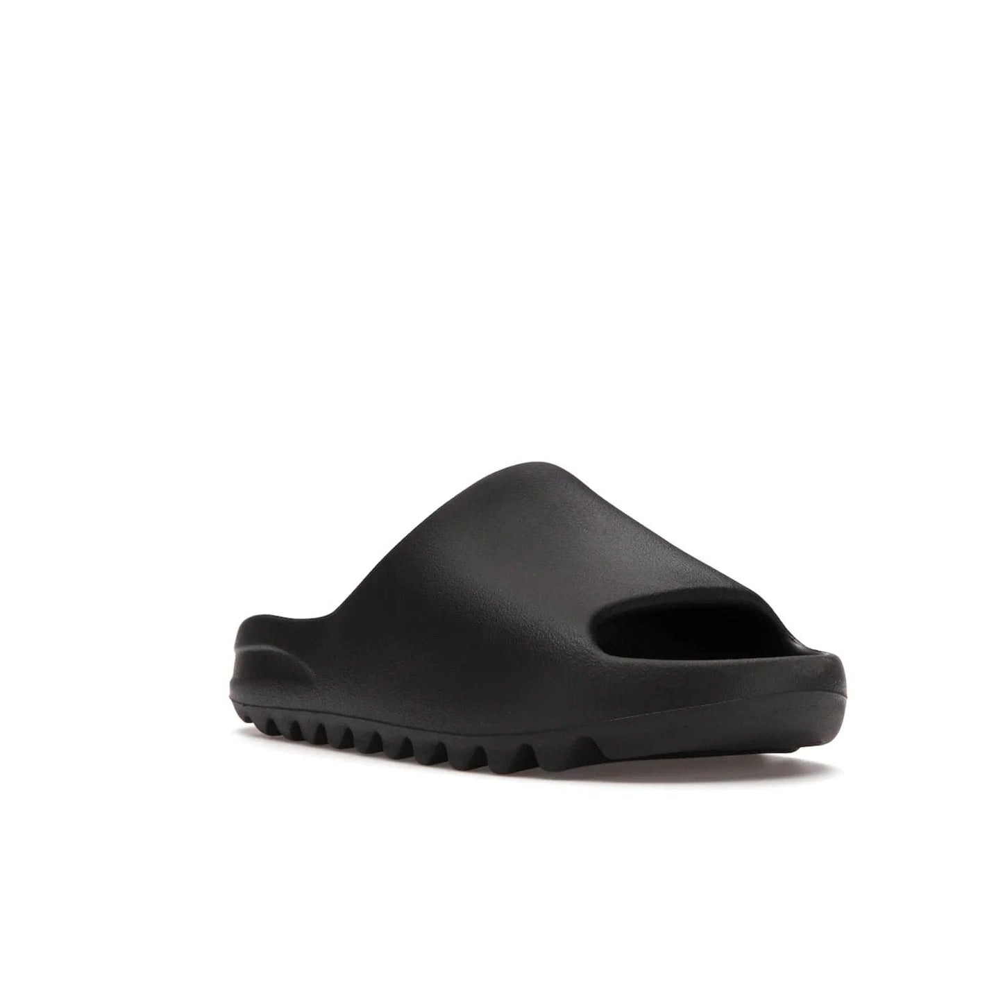 adidas Yeezy Slide Onyx - Image 6 - Only at www.BallersClubKickz.com - Step into comfort and style with the adidas Yeezy Slide Onyx. Featuring foam construction, an all-black colorway and a grooved outsole for stability and responsiveness, this versatile slide is a must-have for your collection.