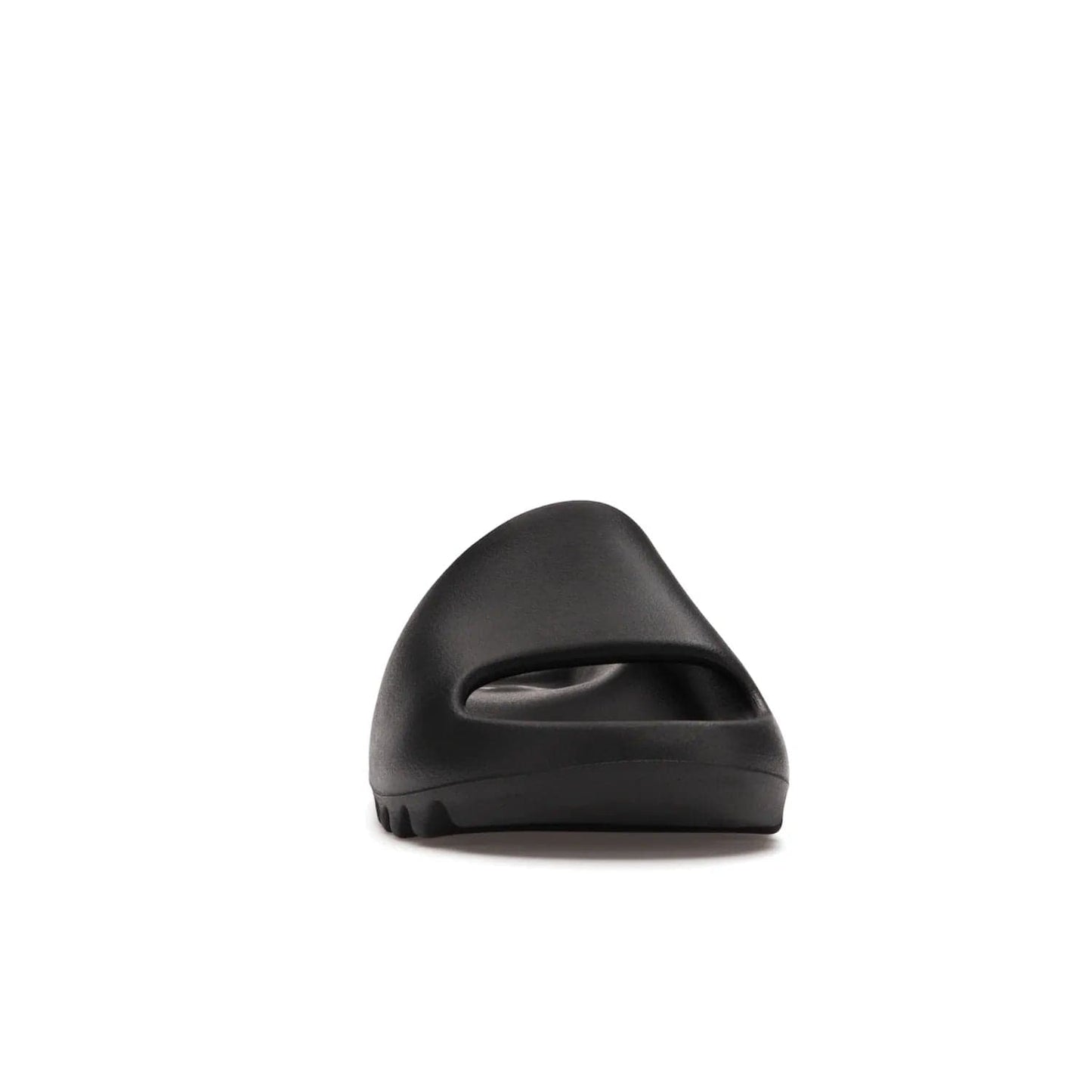 adidas Yeezy Slide Onyx - Image 9 - Only at www.BallersClubKickz.com - Step into comfort and style with the adidas Yeezy Slide Onyx. Featuring foam construction, an all-black colorway and a grooved outsole for stability and responsiveness, this versatile slide is a must-have for your collection.