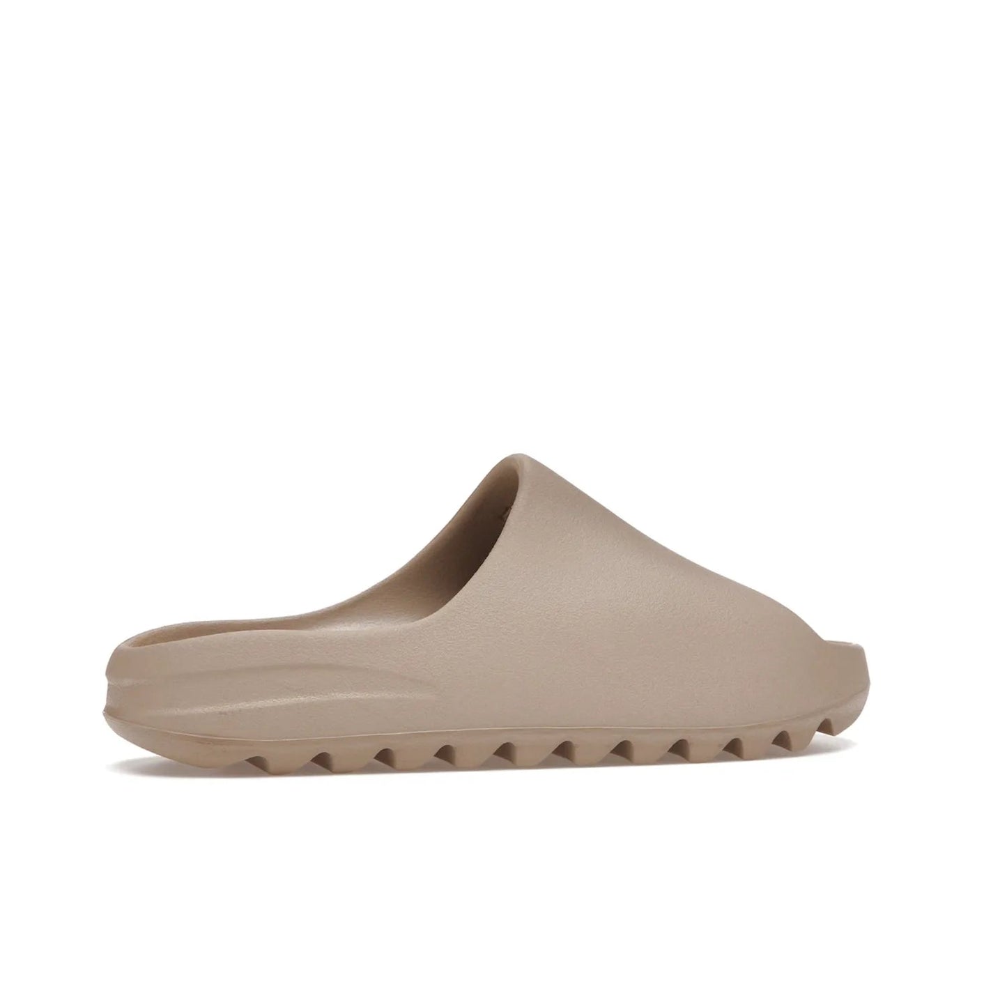 adidas Yeezy Slide Pure (Restock Pair) - Image 35 - Only at www.BallersClubKickz.com - Experience comfort and style with the adidas Yeezy Slide Pure (Restock Pair)! Featuring a pebbled composition and a grooved sole and cushioned footbed, this is the perfect shoe to pair with jeans or joggers. Get ready for the classic Pure/Pure/Pure colorway!