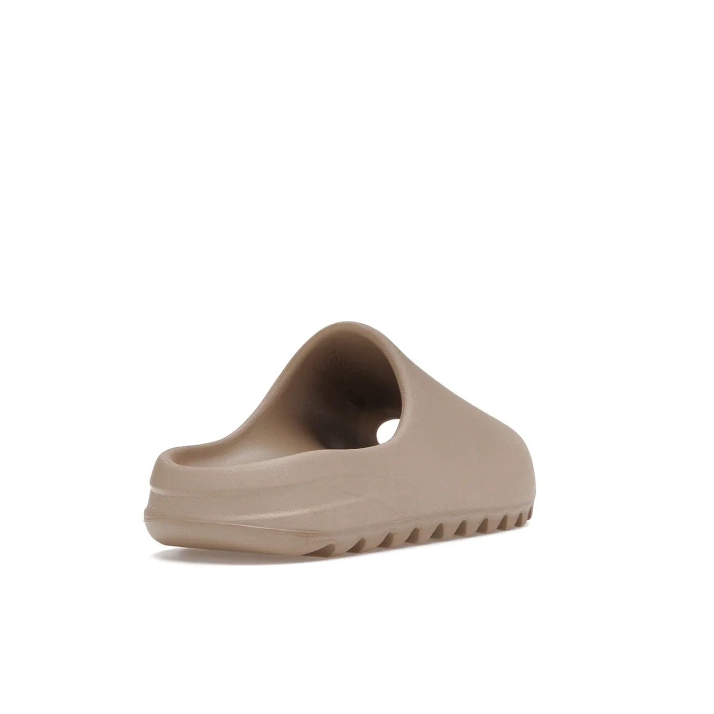 adidas Yeezy Slide Pure (Restock Pair) - Image 31 - Only at www.BallersClubKickz.com - Experience comfort and style with the adidas Yeezy Slide Pure (Restock Pair)! Featuring a pebbled composition and a grooved sole and cushioned footbed, this is the perfect shoe to pair with jeans or joggers. Get ready for the classic Pure/Pure/Pure colorway!