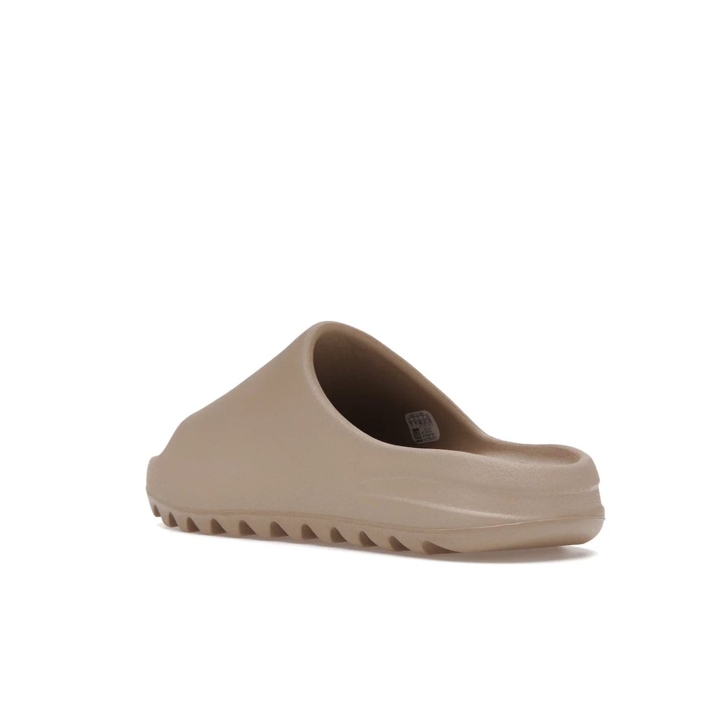adidas Yeezy Slide Pure (Restock Pair) - Image 24 - Only at www.BallersClubKickz.com - Experience comfort and style with the adidas Yeezy Slide Pure (Restock Pair)! Featuring a pebbled composition and a grooved sole and cushioned footbed, this is the perfect shoe to pair with jeans or joggers. Get ready for the classic Pure/Pure/Pure colorway!