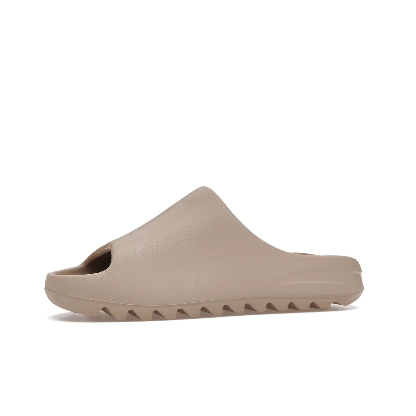 adidas Yeezy Slide Pure (Restock Pair) - Image 17 - Only at www.BallersClubKickz.com - Experience comfort and style with the adidas Yeezy Slide Pure (Restock Pair)! Featuring a pebbled composition and a grooved sole and cushioned footbed, this is the perfect shoe to pair with jeans or joggers. Get ready for the classic Pure/Pure/Pure colorway!