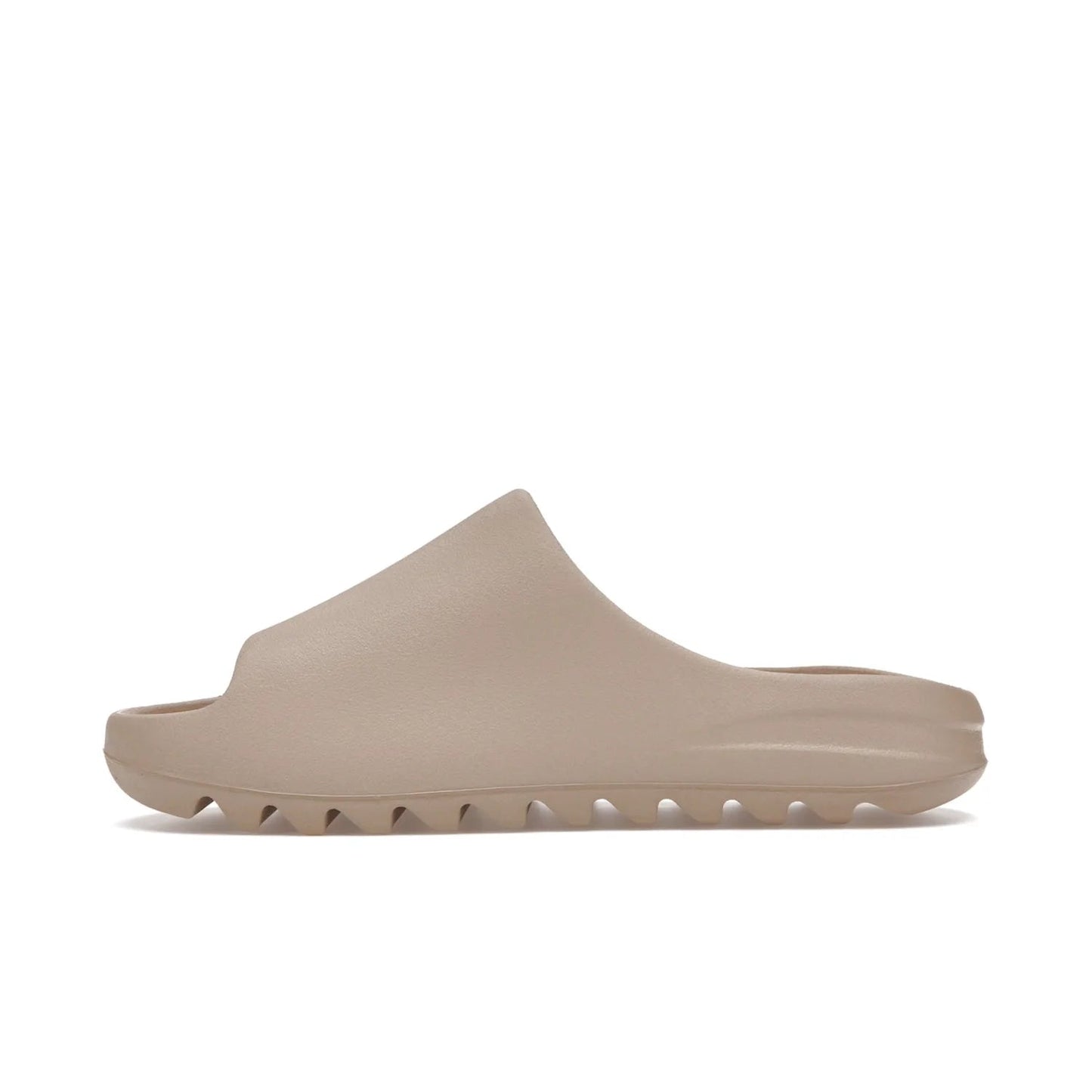 adidas Yeezy Slide Pure (Restock Pair) - Image 19 - Only at www.BallersClubKickz.com - Experience comfort and style with the adidas Yeezy Slide Pure (Restock Pair)! Featuring a pebbled composition and a grooved sole and cushioned footbed, this is the perfect shoe to pair with jeans or joggers. Get ready for the classic Pure/Pure/Pure colorway!