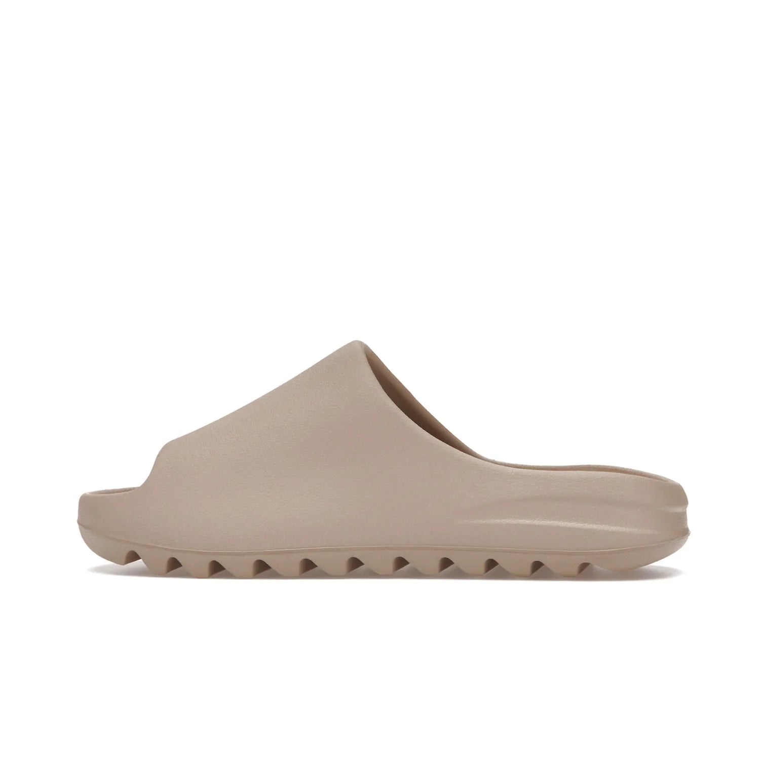 adidas Yeezy Slide Pure (Restock Pair) - Image 20 - Only at www.BallersClubKickz.com - Experience comfort and style with the adidas Yeezy Slide Pure (Restock Pair)! Featuring a pebbled composition and a grooved sole and cushioned footbed, this is the perfect shoe to pair with jeans or joggers. Get ready for the classic Pure/Pure/Pure colorway!