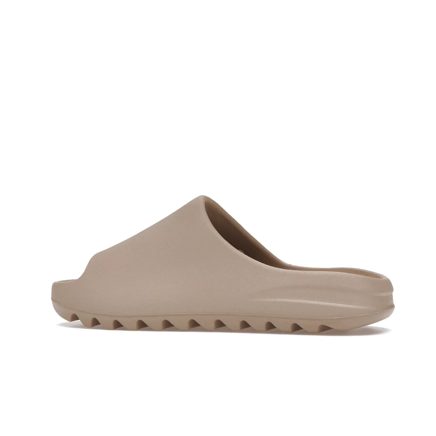 adidas Yeezy Slide Pure (Restock Pair) - Image 21 - Only at www.BallersClubKickz.com - Experience comfort and style with the adidas Yeezy Slide Pure (Restock Pair)! Featuring a pebbled composition and a grooved sole and cushioned footbed, this is the perfect shoe to pair with jeans or joggers. Get ready for the classic Pure/Pure/Pure colorway!
