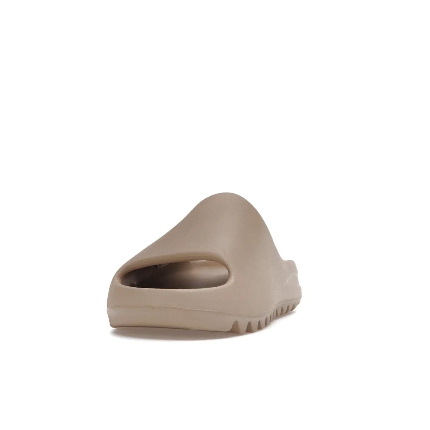 adidas Yeezy Slide Pure (Restock Pair) - Image 12 - Only at www.BallersClubKickz.com - Experience comfort and style with the adidas Yeezy Slide Pure (Restock Pair)! Featuring a pebbled composition and a grooved sole and cushioned footbed, this is the perfect shoe to pair with jeans or joggers. Get ready for the classic Pure/Pure/Pure colorway!