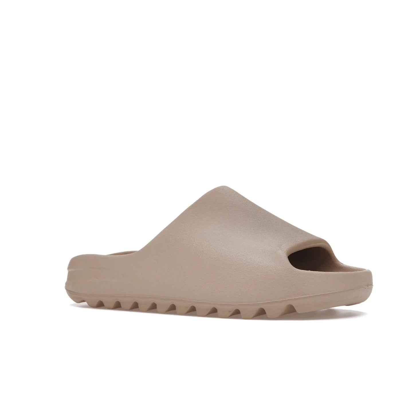 adidas Yeezy Slide Pure (Restock Pair) - Image 4 - Only at www.BallersClubKickz.com - Experience comfort and style with the adidas Yeezy Slide Pure (Restock Pair)! Featuring a pebbled composition and a grooved sole and cushioned footbed, this is the perfect shoe to pair with jeans or joggers. Get ready for the classic Pure/Pure/Pure colorway!