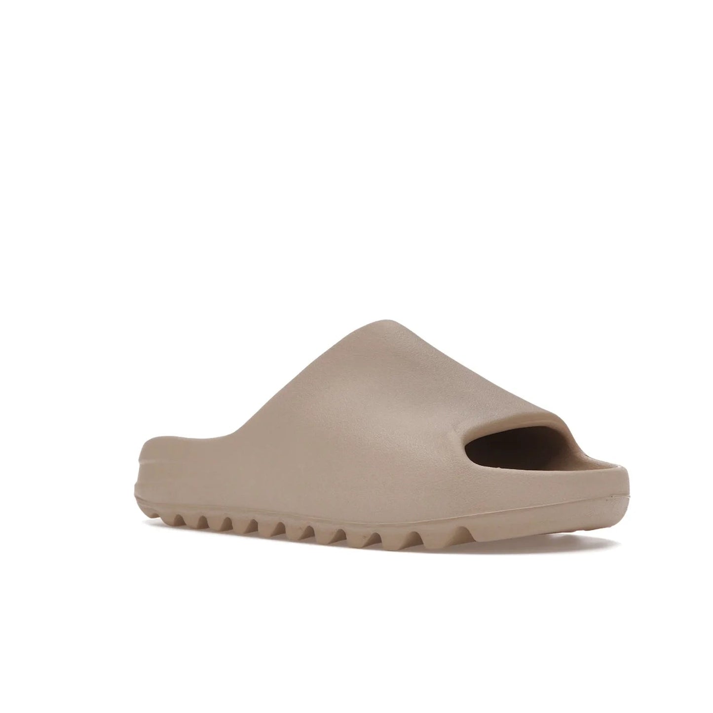 adidas Yeezy Slide Pure (Restock Pair) - Image 5 - Only at www.BallersClubKickz.com - Experience comfort and style with the adidas Yeezy Slide Pure (Restock Pair)! Featuring a pebbled composition and a grooved sole and cushioned footbed, this is the perfect shoe to pair with jeans or joggers. Get ready for the classic Pure/Pure/Pure colorway!