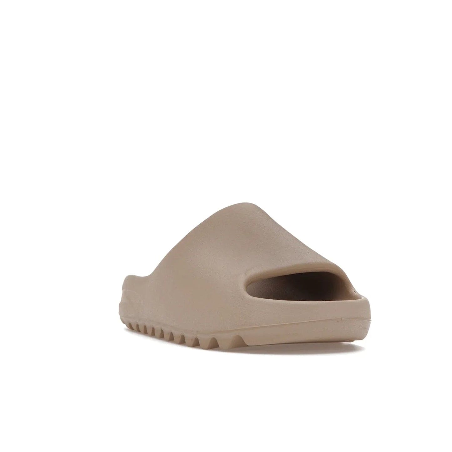 adidas Yeezy Slide Pure (Restock Pair) - Image 7 - Only at www.BallersClubKickz.com - Experience comfort and style with the adidas Yeezy Slide Pure (Restock Pair)! Featuring a pebbled composition and a grooved sole and cushioned footbed, this is the perfect shoe to pair with jeans or joggers. Get ready for the classic Pure/Pure/Pure colorway!