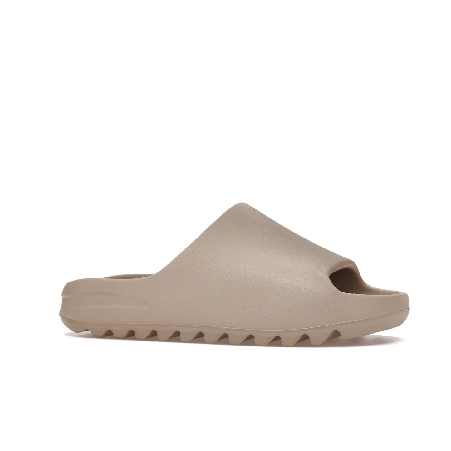adidas Yeezy Slide Pure (Restock Pair) - Image 3 - Only at www.BallersClubKickz.com - Experience comfort and style with the adidas Yeezy Slide Pure (Restock Pair)! Featuring a pebbled composition and a grooved sole and cushioned footbed, this is the perfect shoe to pair with jeans or joggers. Get ready for the classic Pure/Pure/Pure colorway!