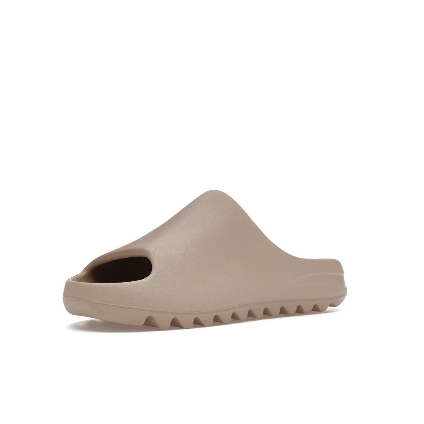 adidas Yeezy Slide Pure (Restock Pair) - Image 15 - Only at www.BallersClubKickz.com - Experience comfort and style with the adidas Yeezy Slide Pure (Restock Pair)! Featuring a pebbled composition and a grooved sole and cushioned footbed, this is the perfect shoe to pair with jeans or joggers. Get ready for the classic Pure/Pure/Pure colorway!