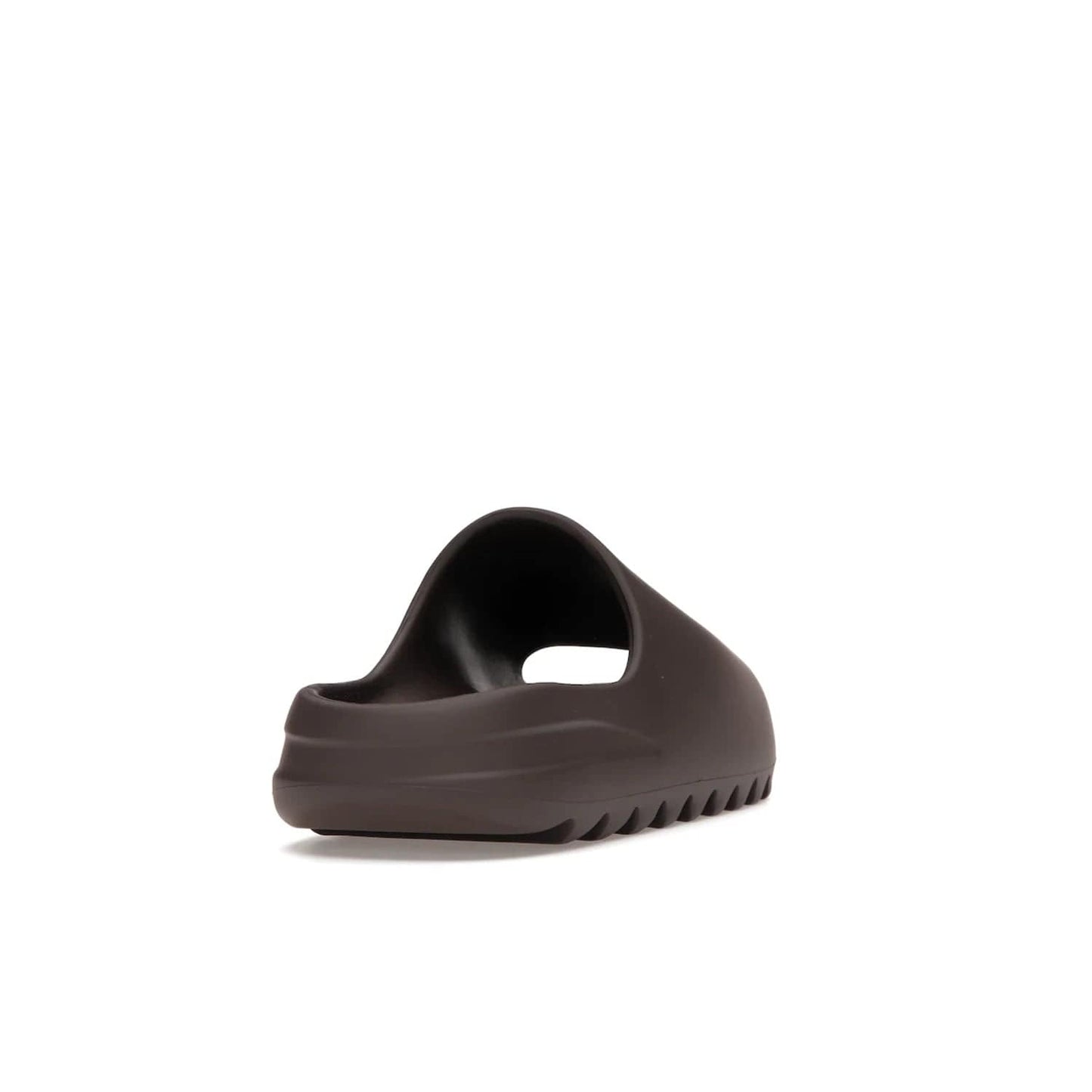 adidas Yeezy Slide Soot - Image 30 - Only at www.BallersClubKickz.com - Shop the Yeezy Slide Soot sneaker by Adidas, a sleek blend of form and function. Monochrome silhouette in Soot/Soot/Soot. Lightweight EVA foam offers comfort and durability. Get the must-have style today.