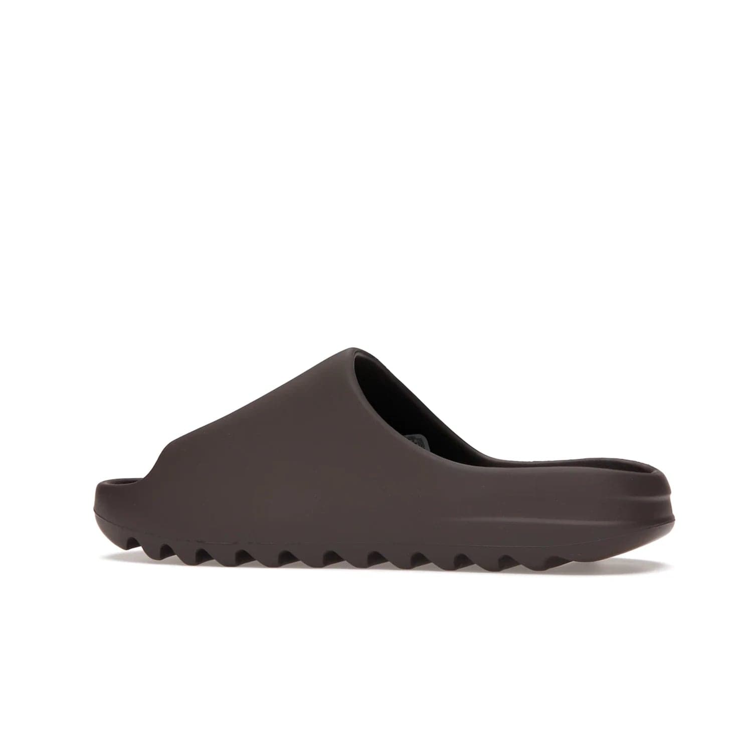 adidas Yeezy Slide Soot - Image 21 - Only at www.BallersClubKickz.com - Shop the Yeezy Slide Soot sneaker by Adidas, a sleek blend of form and function. Monochrome silhouette in Soot/Soot/Soot. Lightweight EVA foam offers comfort and durability. Get the must-have style today.