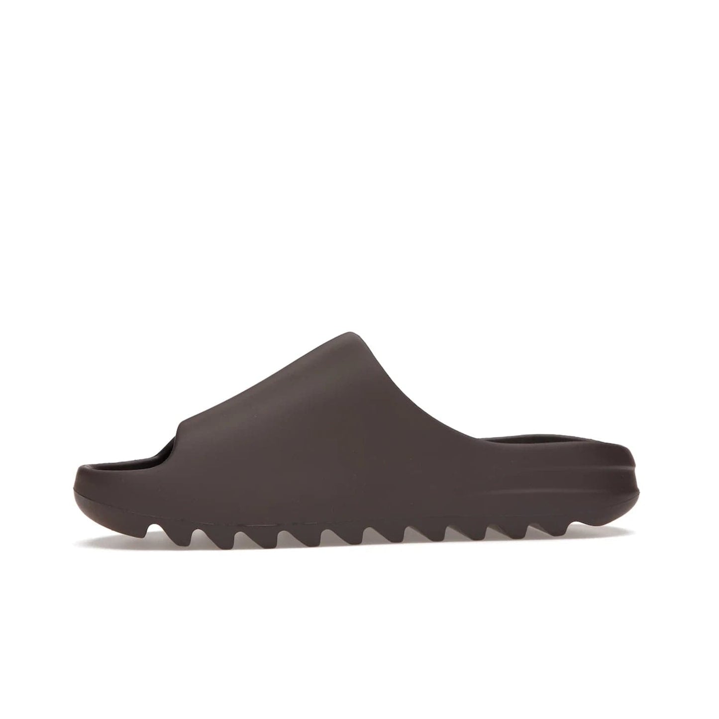 adidas Yeezy Slide Soot - Image 18 - Only at www.BallersClubKickz.com - Shop the Yeezy Slide Soot sneaker by Adidas, a sleek blend of form and function. Monochrome silhouette in Soot/Soot/Soot. Lightweight EVA foam offers comfort and durability. Get the must-have style today.