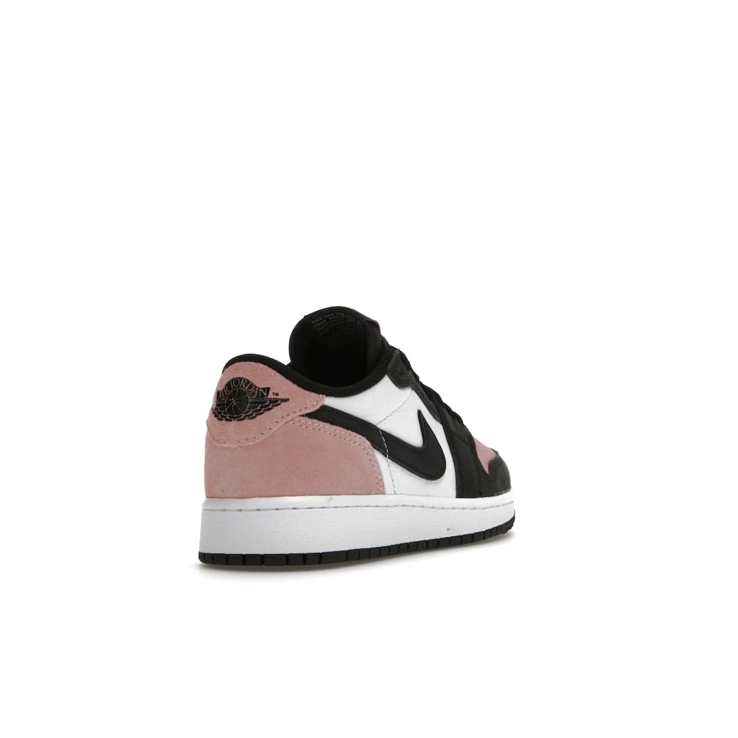 Jordan 1 Low OG Bleached Coral (GS) - Image 31 - Only at www.BallersClubKickz.com - Look cool and classic in the Air Jordan 1 Low OG Bleached Coral (Gradeschool). White leather upper with bleached coral accents, black toe and Swooshes, and perforated toe box for breathability. Style with jeans or shorts for an effortless look. Released July 2022.