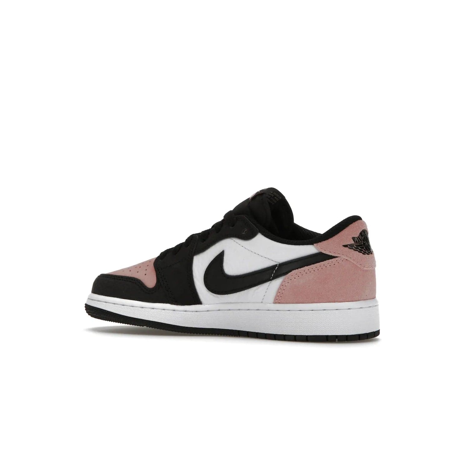 Jordan 1 Low OG Bleached Coral (GS) - Image 22 - Only at www.BallersClubKickz.com - Look cool and classic in the Air Jordan 1 Low OG Bleached Coral (Gradeschool). White leather upper with bleached coral accents, black toe and Swooshes, and perforated toe box for breathability. Style with jeans or shorts for an effortless look. Released July 2022.