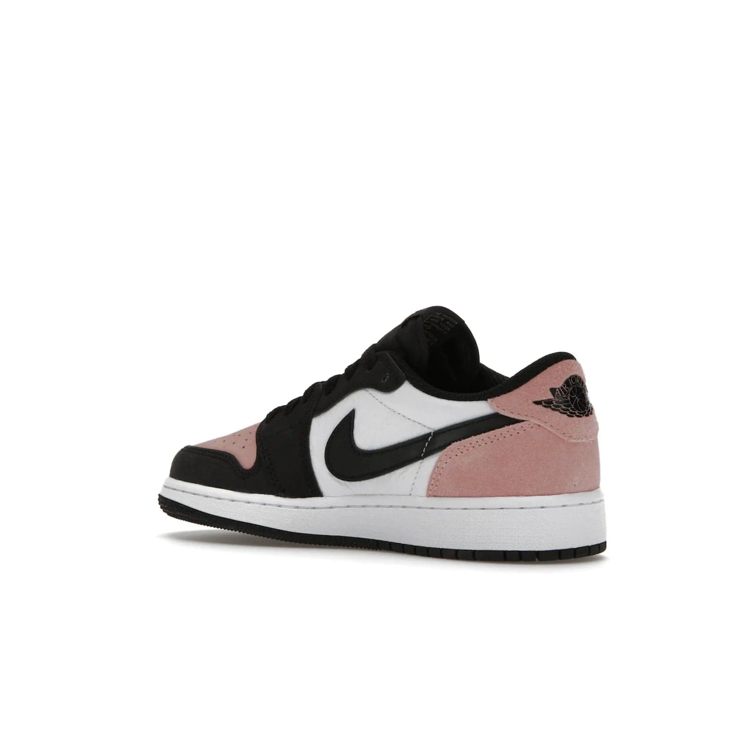 Jordan 1 Low OG Bleached Coral (GS) - Image 23 - Only at www.BallersClubKickz.com - Look cool and classic in the Air Jordan 1 Low OG Bleached Coral (Gradeschool). White leather upper with bleached coral accents, black toe and Swooshes, and perforated toe box for breathability. Style with jeans or shorts for an effortless look. Released July 2022.