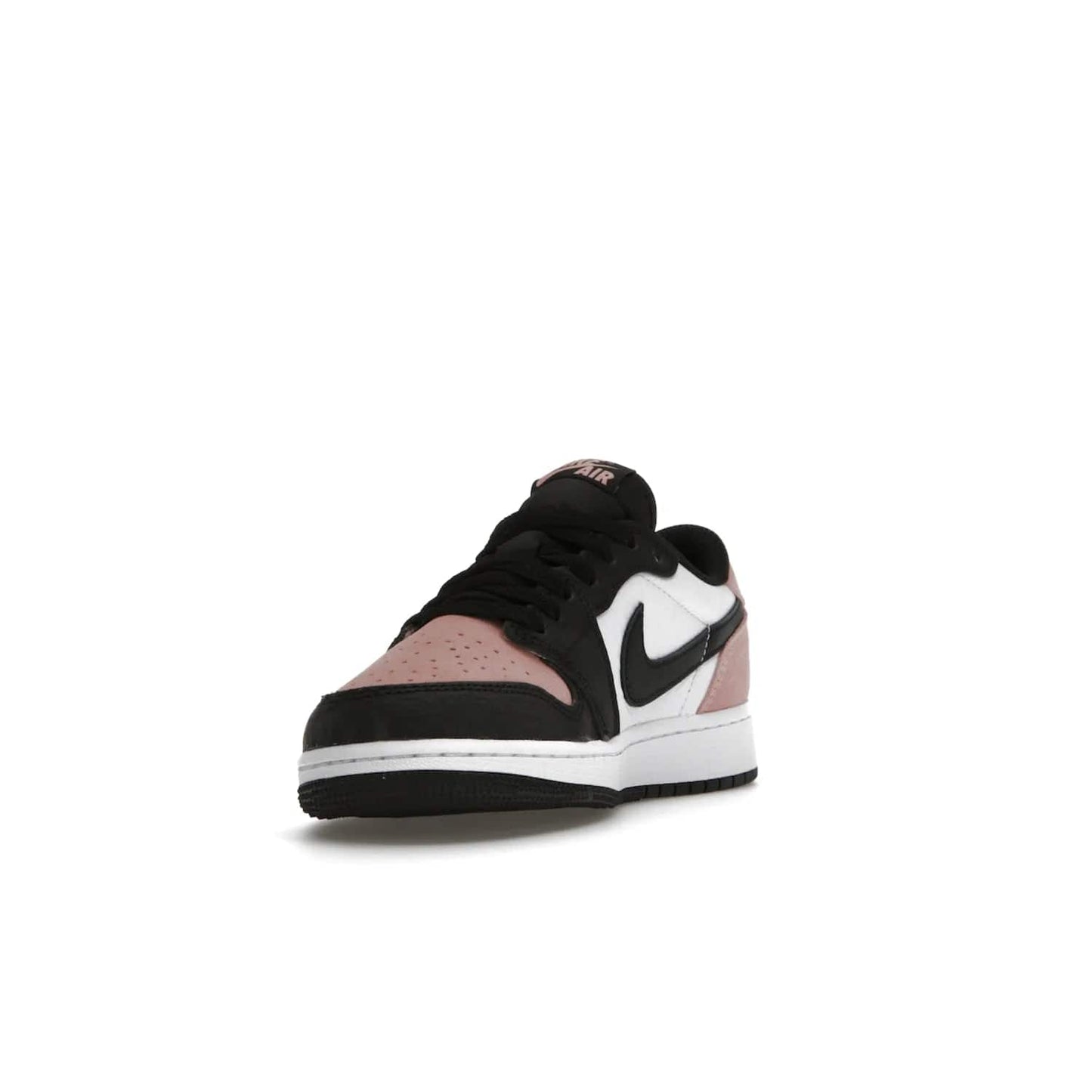 Jordan 1 Low OG Bleached Coral (GS) - Image 13 - Only at www.BallersClubKickz.com - Look cool and classic in the Air Jordan 1 Low OG Bleached Coral (Gradeschool). White leather upper with bleached coral accents, black toe and Swooshes, and perforated toe box for breathability. Style with jeans or shorts for an effortless look. Released July 2022.