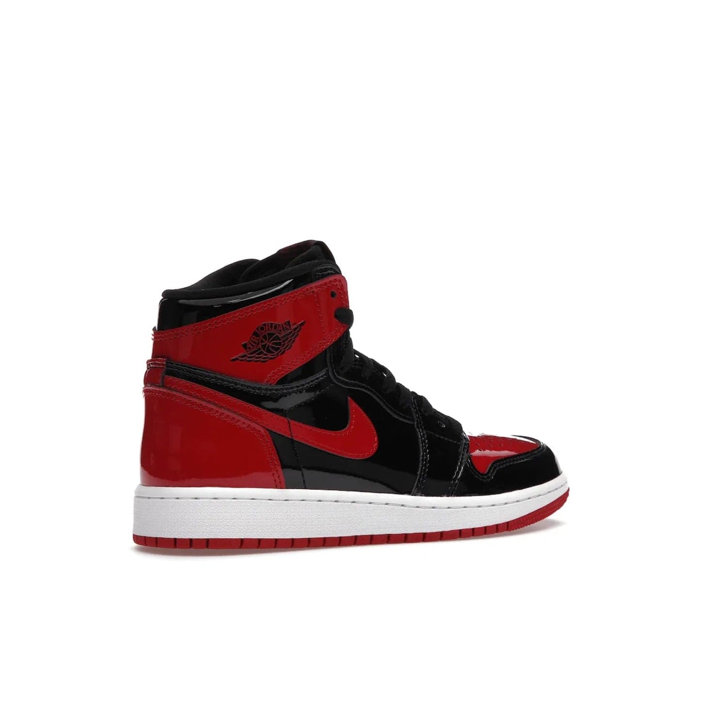 Jordan 1 Retro High OG Patent Bred (GS) - Image 34 - Only at www.BallersClubKickz.com - Upgrade your sneaker game with the iconic Air Jordan 1 Retro High OG Bred Patent GS. Crafted with premium patent leather and basketball-inspired details for a classic look, they also feature an encapsulated Air-sole cushioning and enhanced red rubber outsole. Don't miss this timeless sneaker with a striking black, white, and varsity red colorway, dropping December 2021.