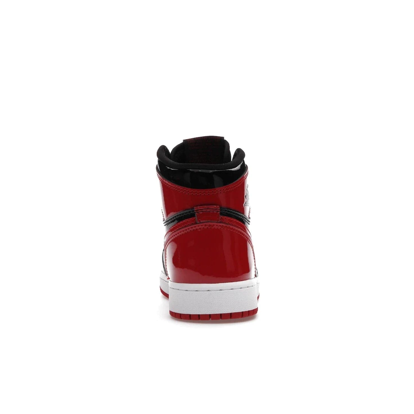 Jordan 1 Retro High OG Patent Bred (GS) - Image 28 - Only at www.BallersClubKickz.com - Upgrade your sneaker game with the iconic Air Jordan 1 Retro High OG Bred Patent GS. Crafted with premium patent leather and basketball-inspired details for a classic look, they also feature an encapsulated Air-sole cushioning and enhanced red rubber outsole. Don't miss this timeless sneaker with a striking black, white, and varsity red colorway, dropping December 2021.
