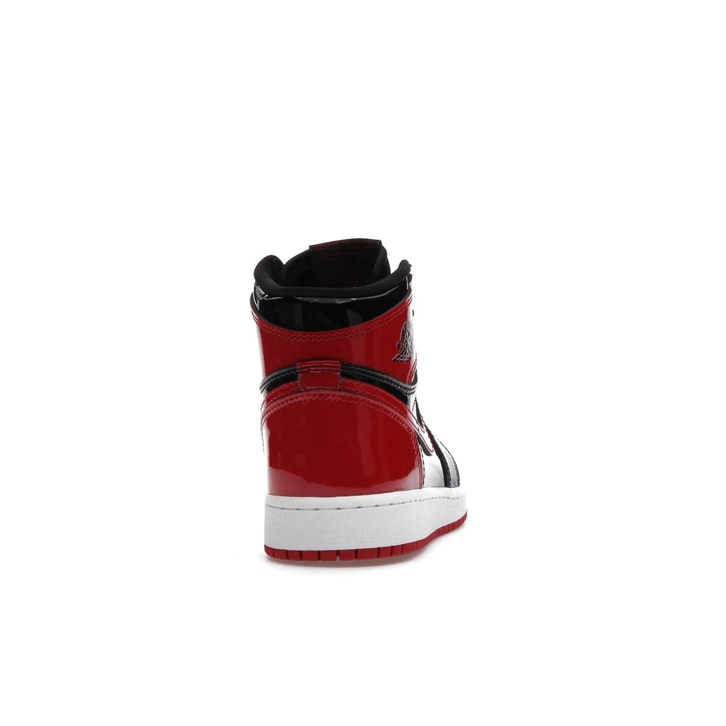 Jordan 1 Retro High OG Patent Bred (GS) - Image 29 - Only at www.BallersClubKickz.com - Upgrade your sneaker game with the iconic Air Jordan 1 Retro High OG Bred Patent GS. Crafted with premium patent leather and basketball-inspired details for a classic look, they also feature an encapsulated Air-sole cushioning and enhanced red rubber outsole. Don't miss this timeless sneaker with a striking black, white, and varsity red colorway, dropping December 2021.
