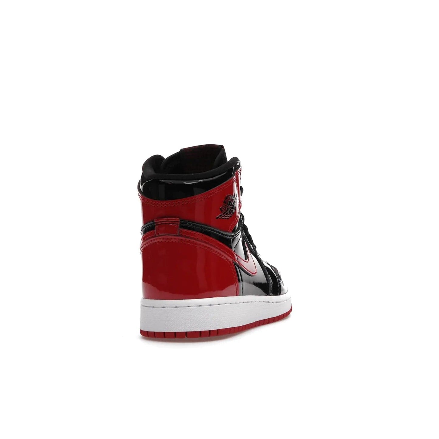 Jordan 1 Retro High OG Patent Bred (GS) - Image 30 - Only at www.BallersClubKickz.com - Upgrade your sneaker game with the iconic Air Jordan 1 Retro High OG Bred Patent GS. Crafted with premium patent leather and basketball-inspired details for a classic look, they also feature an encapsulated Air-sole cushioning and enhanced red rubber outsole. Don't miss this timeless sneaker with a striking black, white, and varsity red colorway, dropping December 2021.