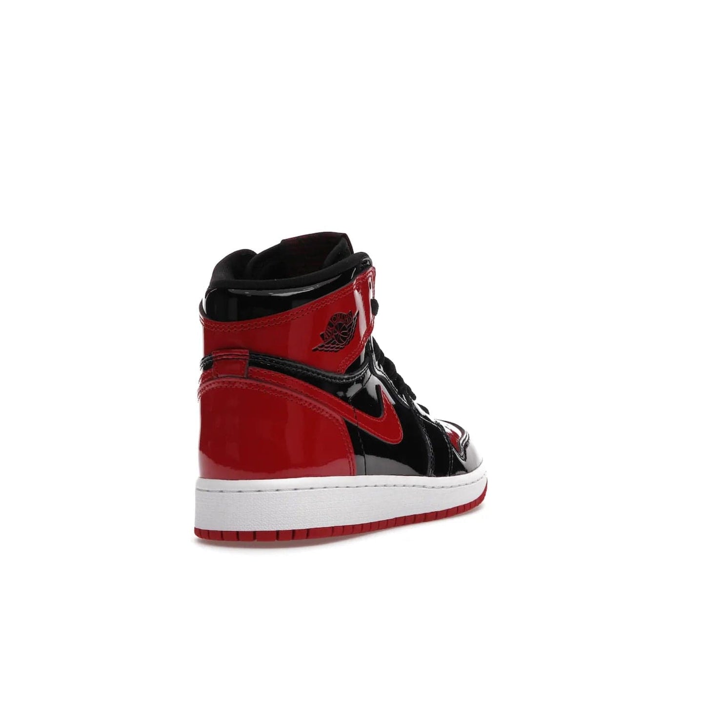 Jordan 1 Retro High OG Patent Bred (GS) - Image 31 - Only at www.BallersClubKickz.com - Upgrade your sneaker game with the iconic Air Jordan 1 Retro High OG Bred Patent GS. Crafted with premium patent leather and basketball-inspired details for a classic look, they also feature an encapsulated Air-sole cushioning and enhanced red rubber outsole. Don't miss this timeless sneaker with a striking black, white, and varsity red colorway, dropping December 2021.